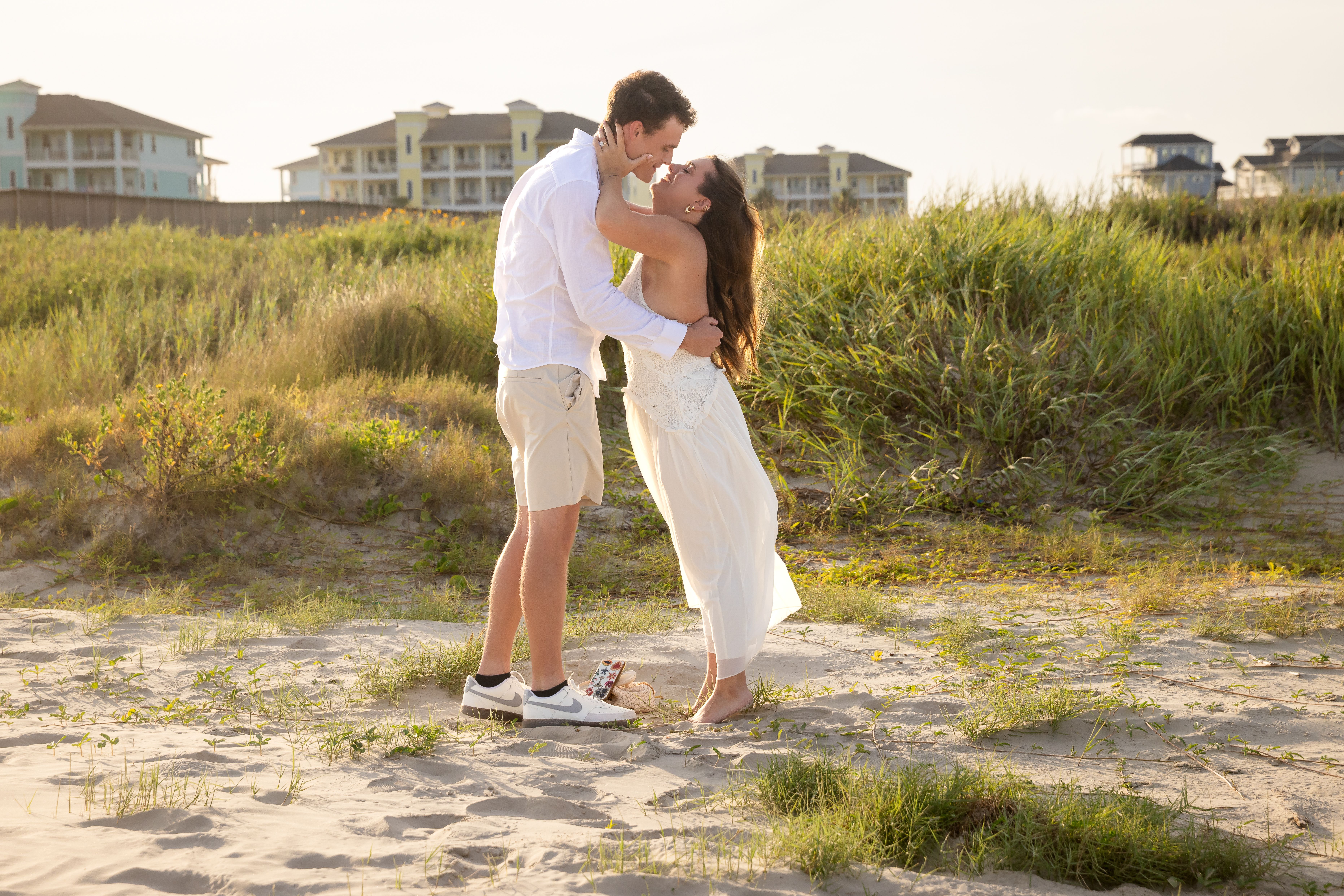 Couple touching foreheads on the beach