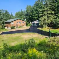 Sealed driveway with rural property