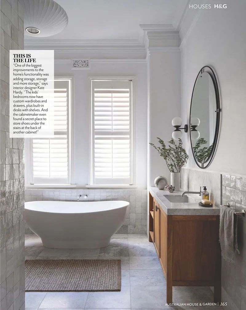 Bathroom with brass fixtures and freestanding bath