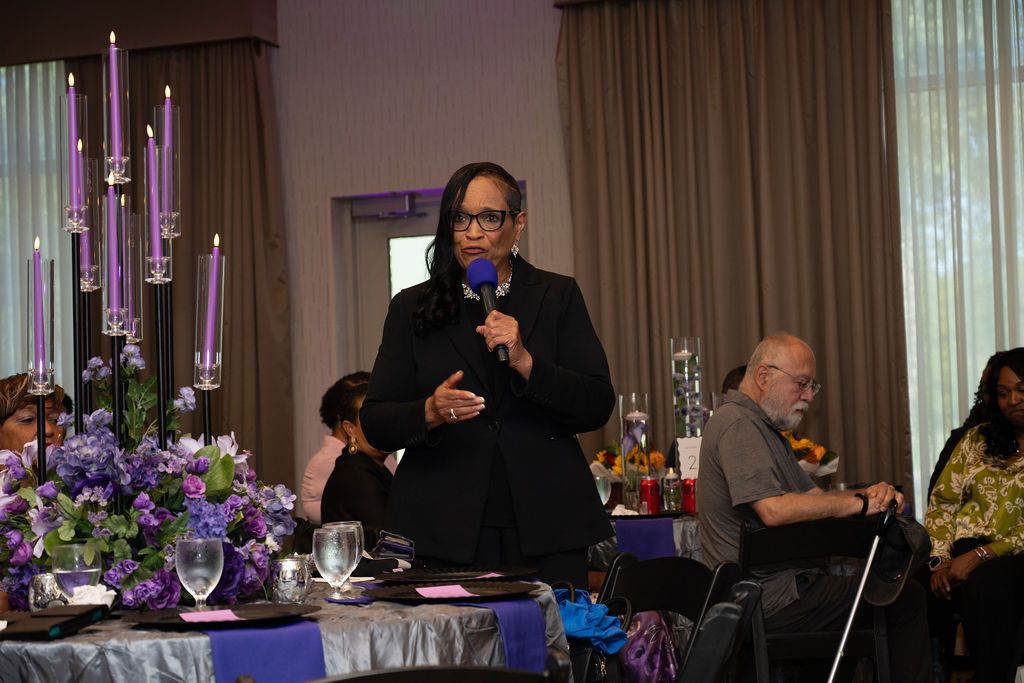 Speaker addressing audience at event