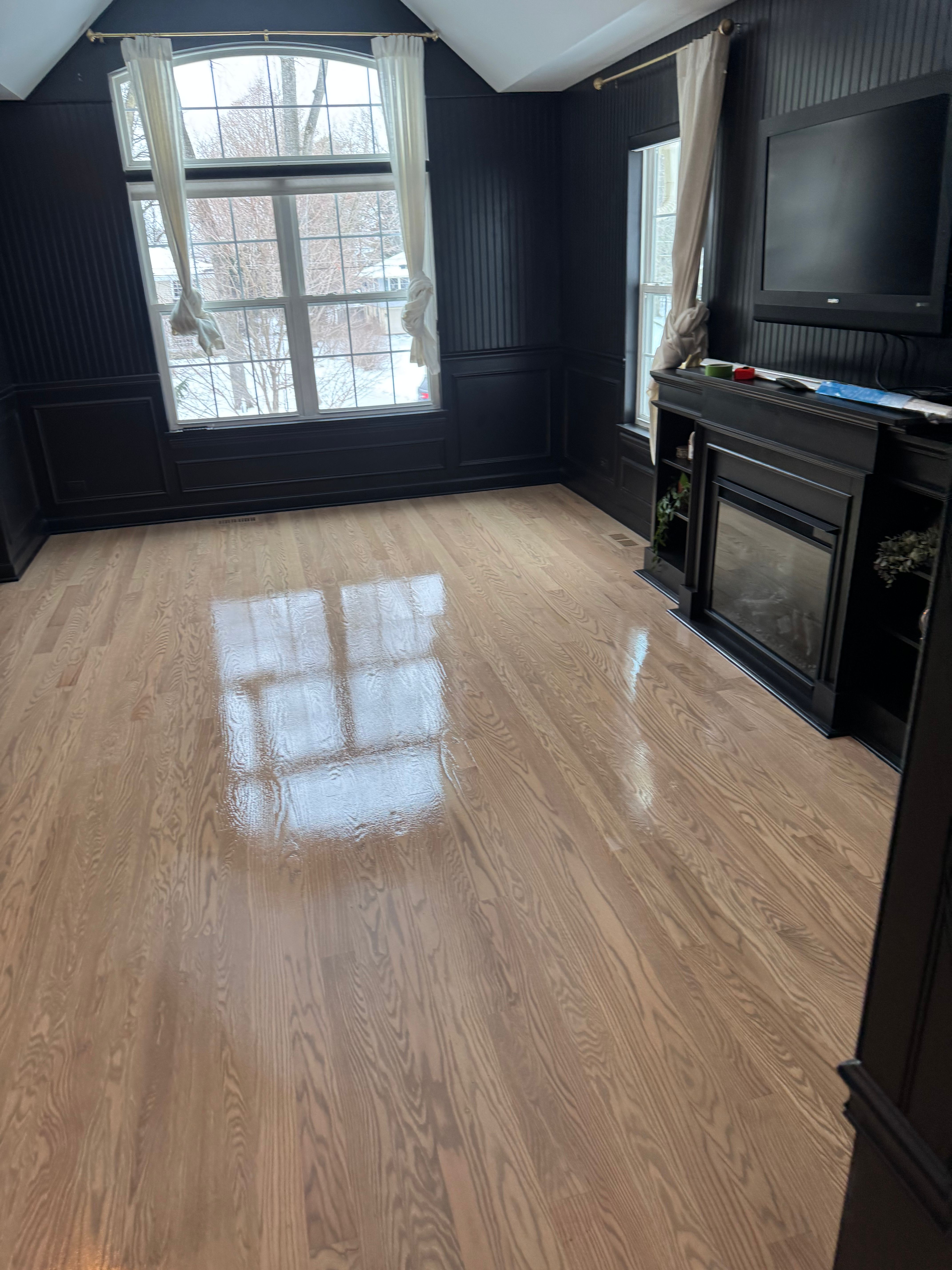 Hardwood floor refinishing in progress in Rockford IL