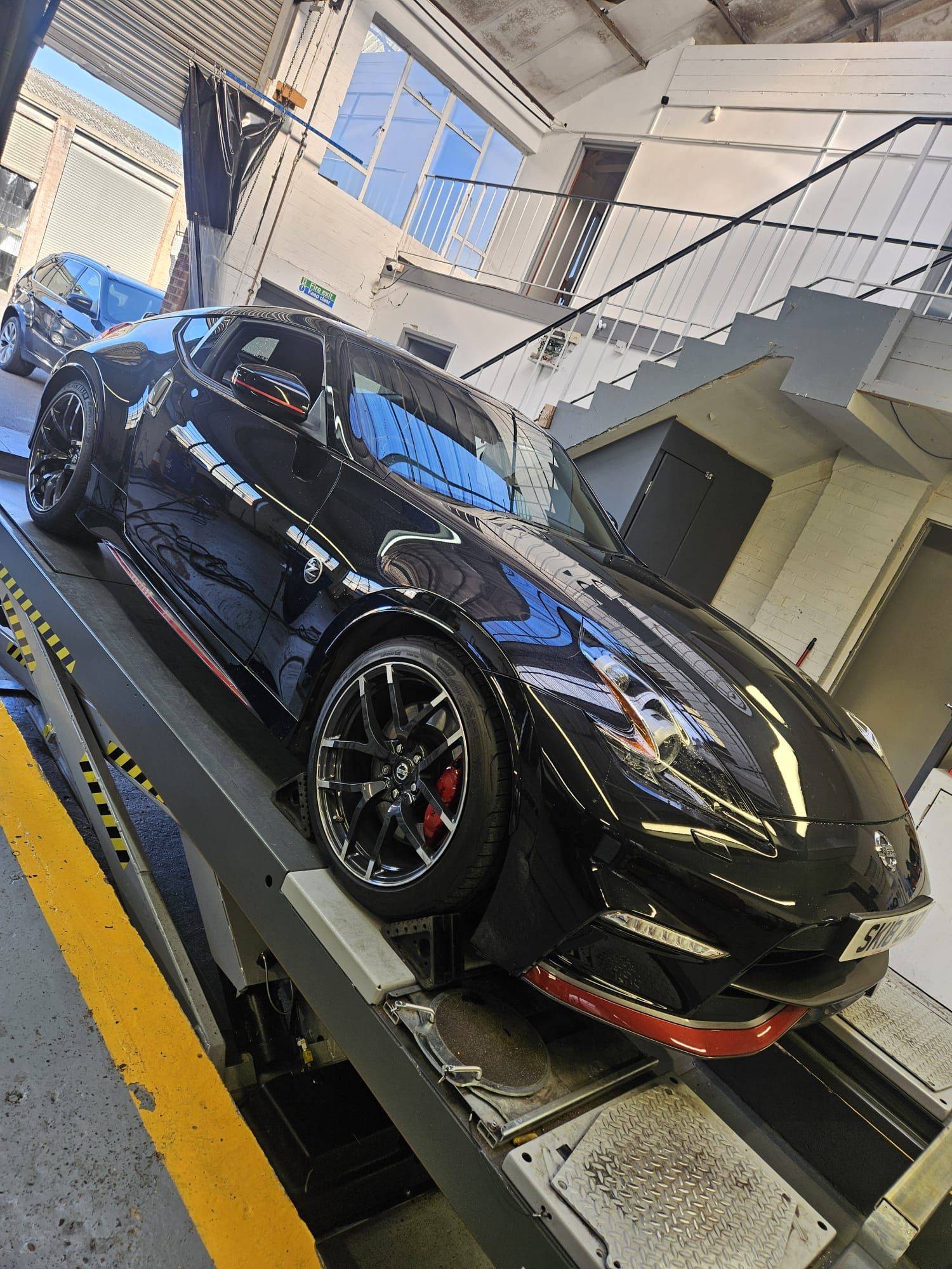 Sports car on lift in workshop
