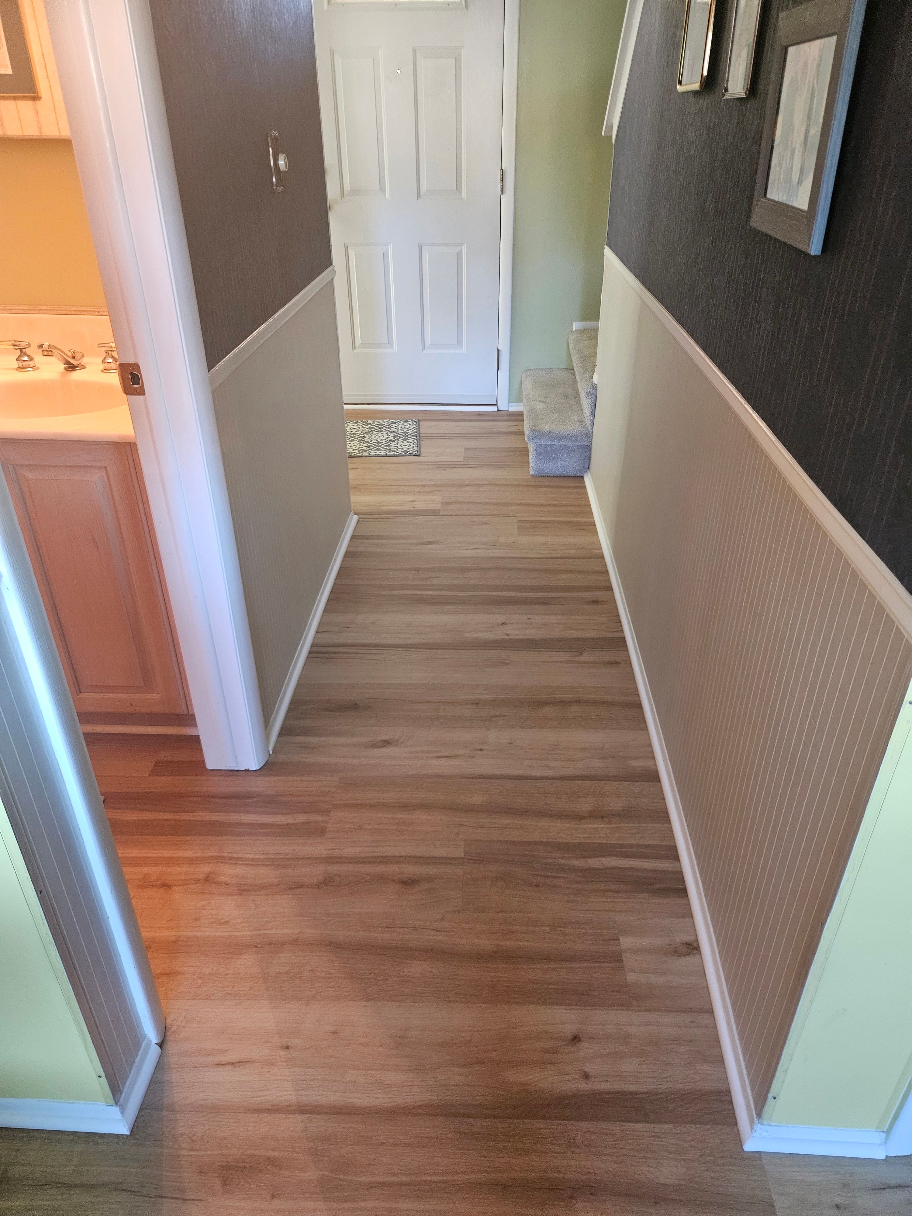 Hallway with wainscoting and trim work