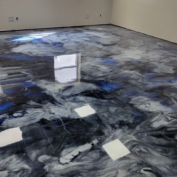 Swirling black, gray, white and blue epoxy floor — warehouse installation Chicagoland