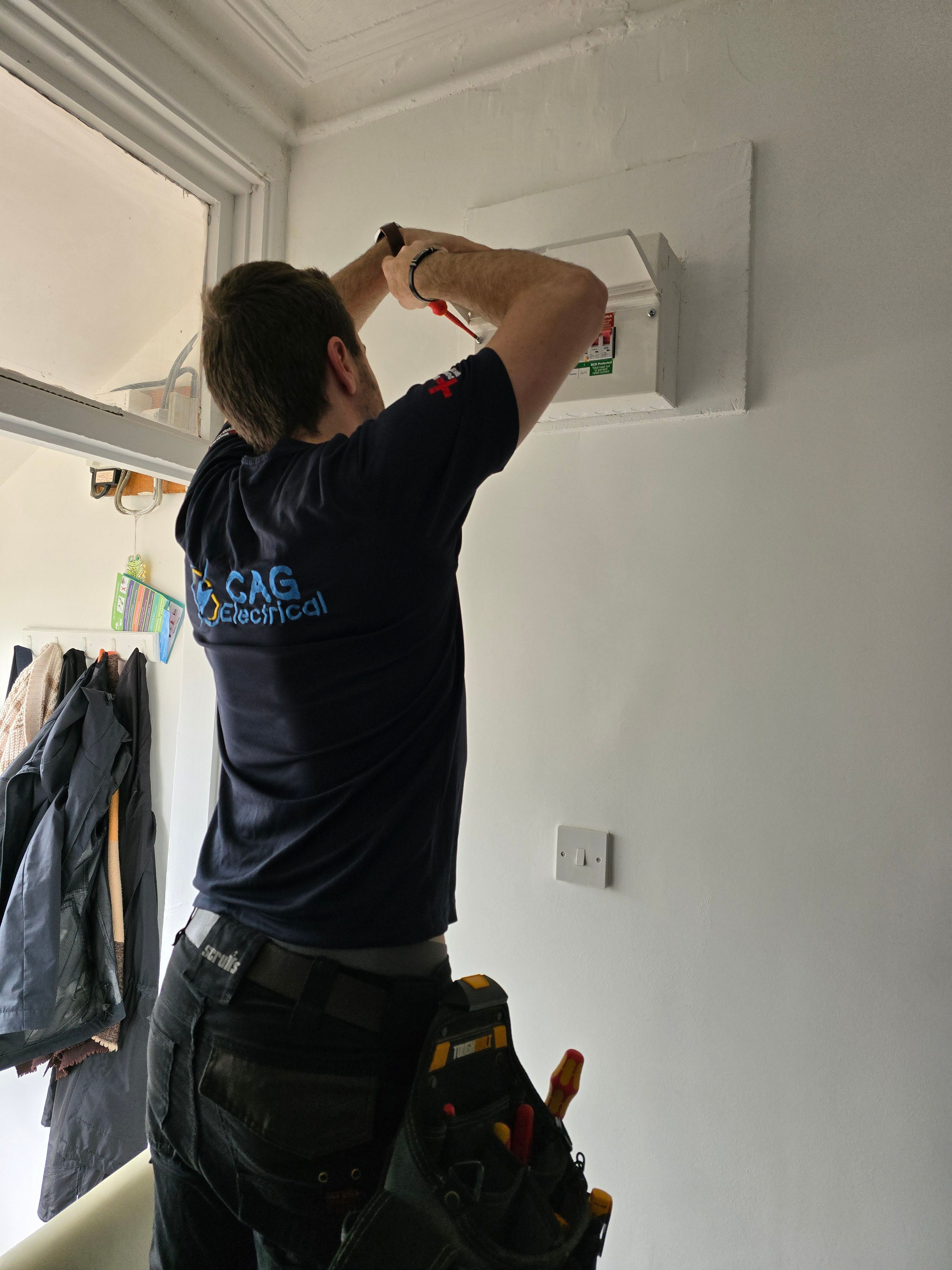 Electrician Cardiff and Newport working on electrical panel installation