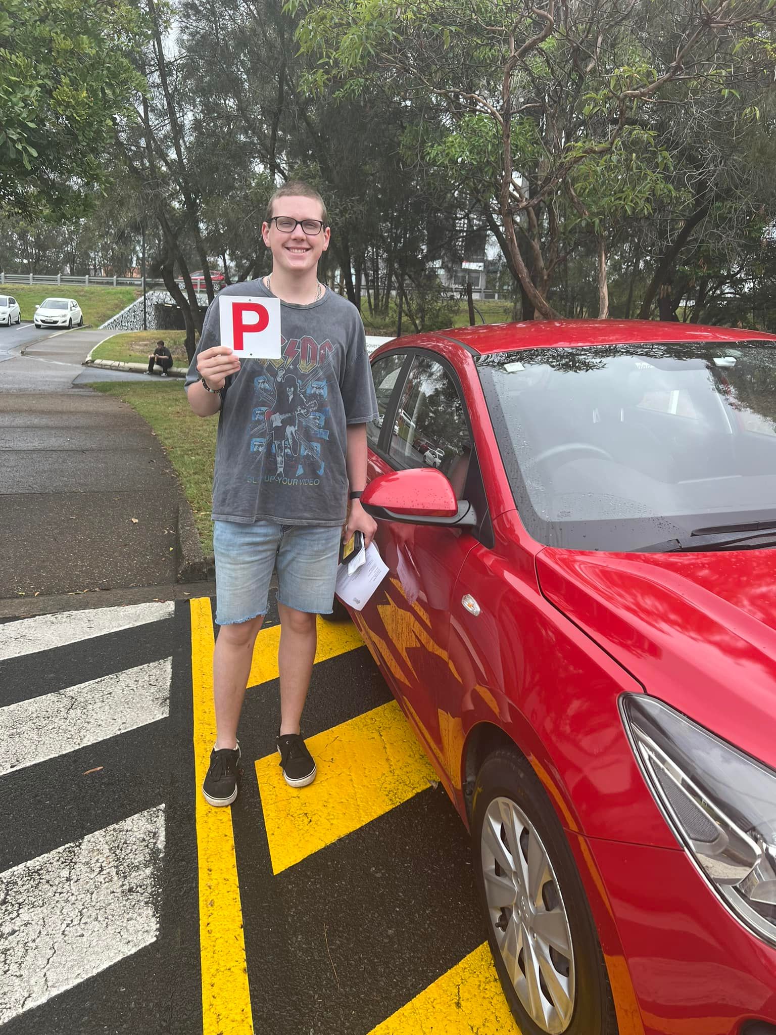 Young driver displaying P plates after passing driving test at Southport test centre Gold Coast