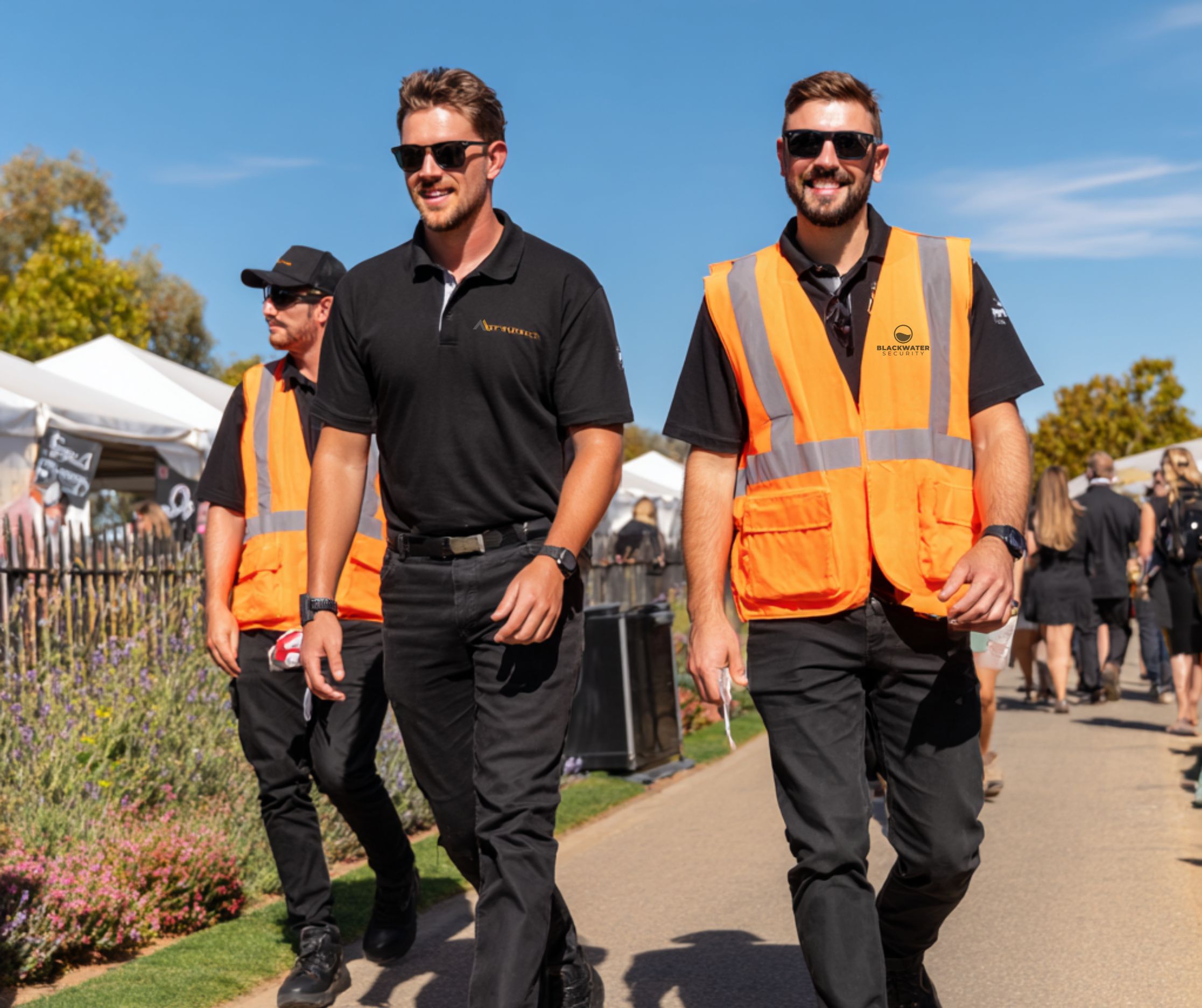 Blackwater Security team walking at an outdoor event