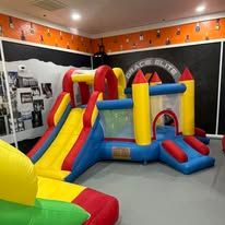 Indoor inflatable bounce house at Bay County Premium Birthday Zone