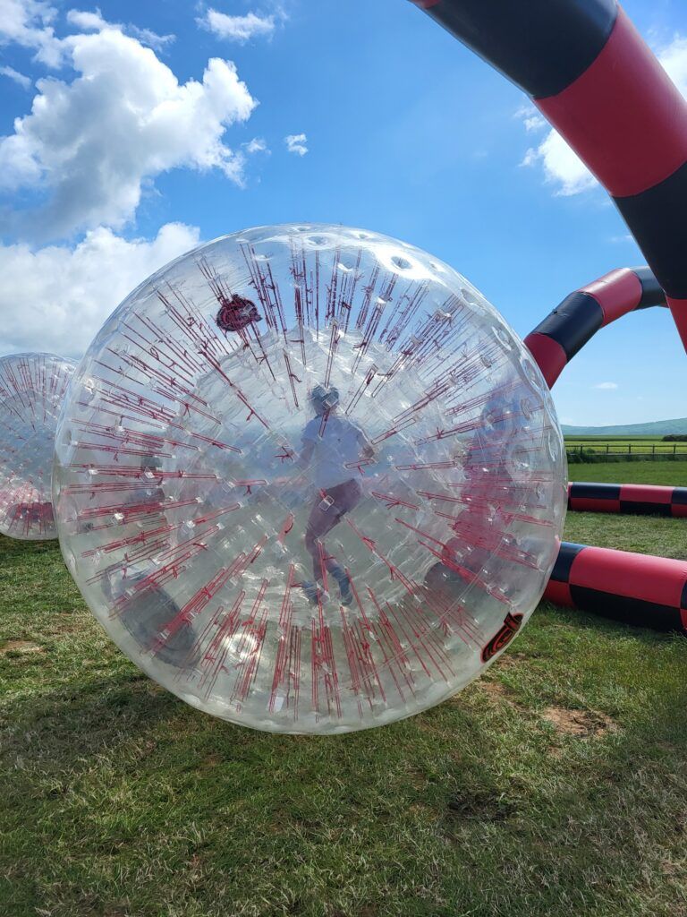 Zorbing bubble football team building activity outdoors