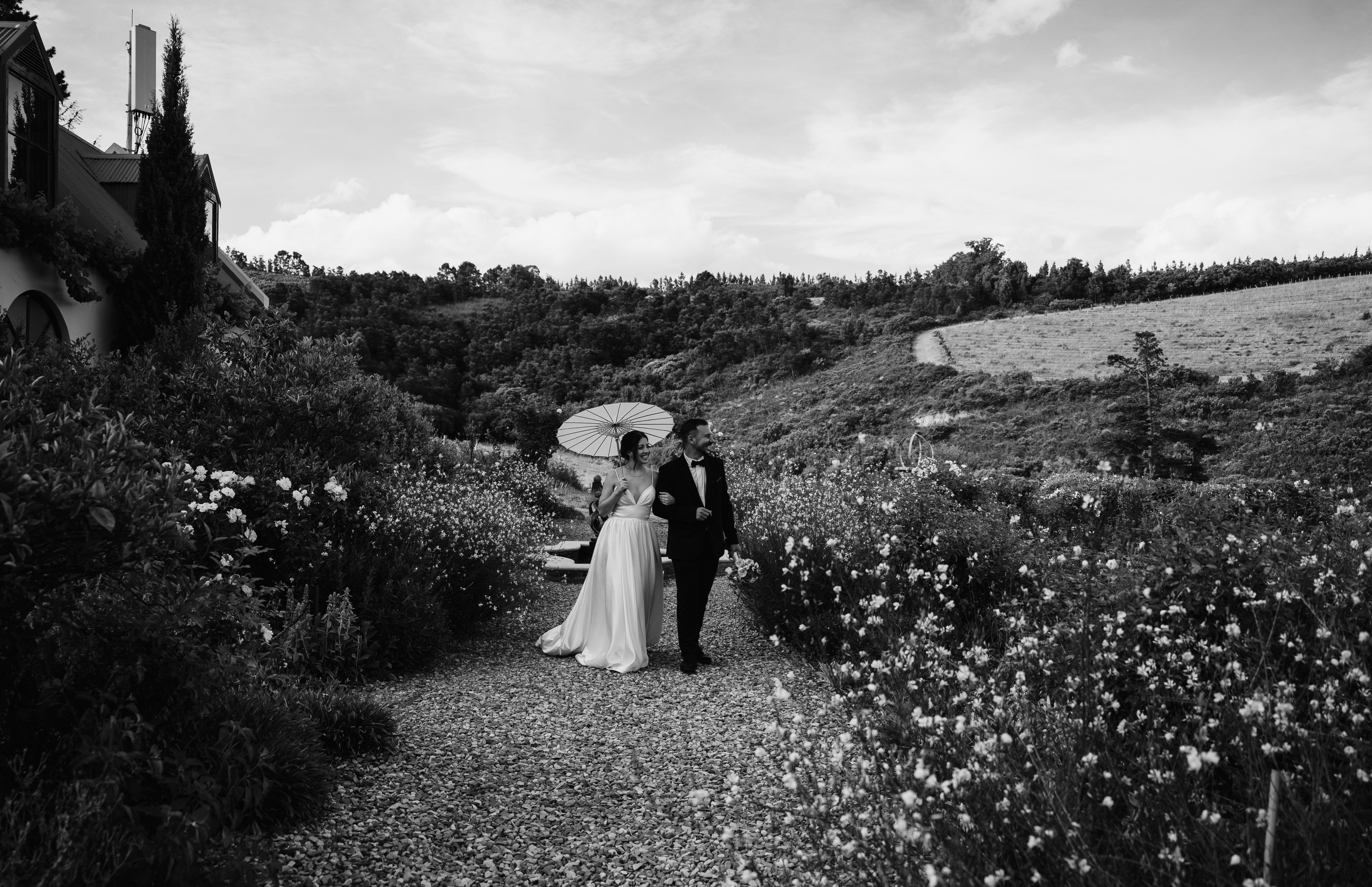 Couple walking hand in hand through the Winelands