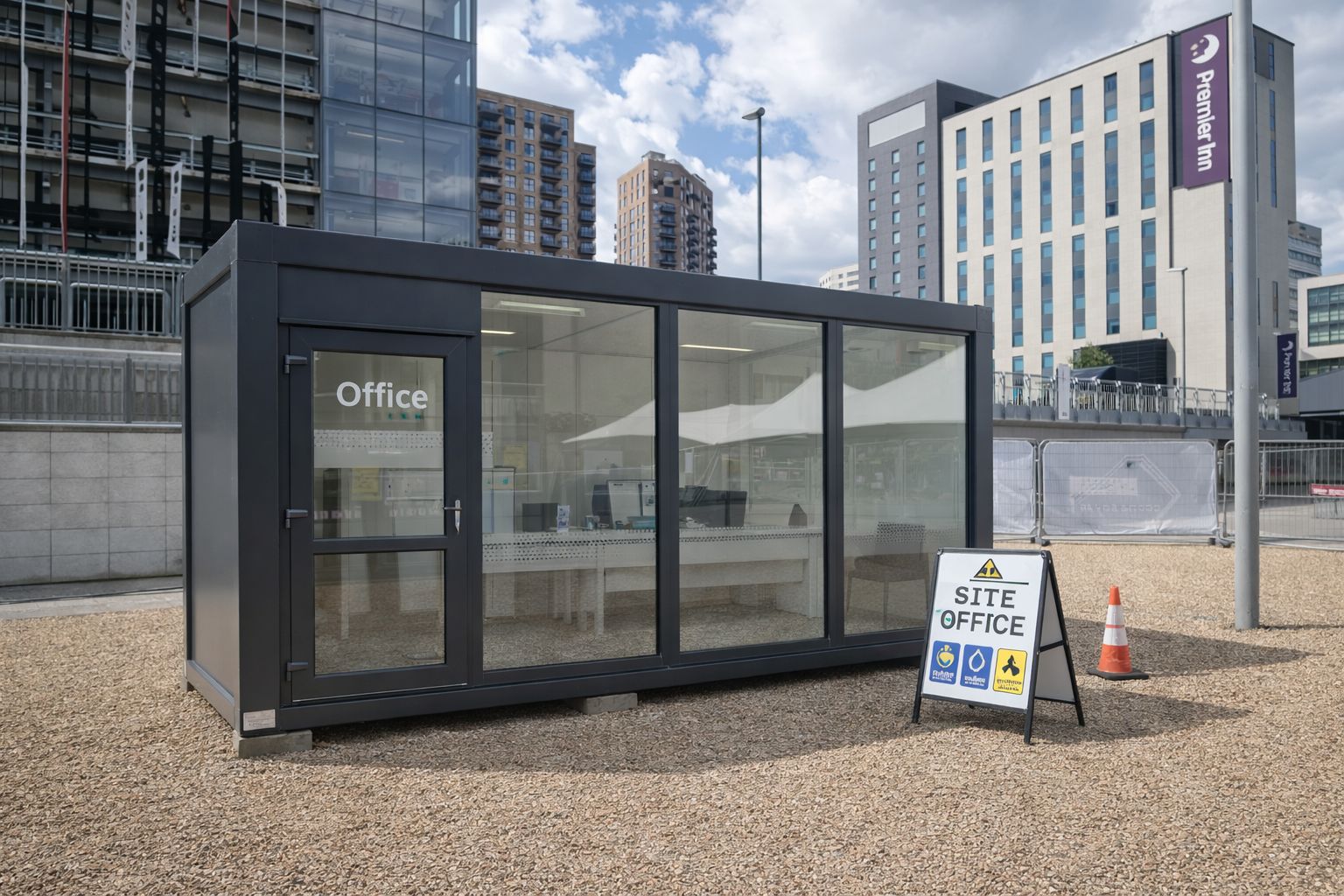 Single-storey glazed modular site office cabin on an urban UK construction setting