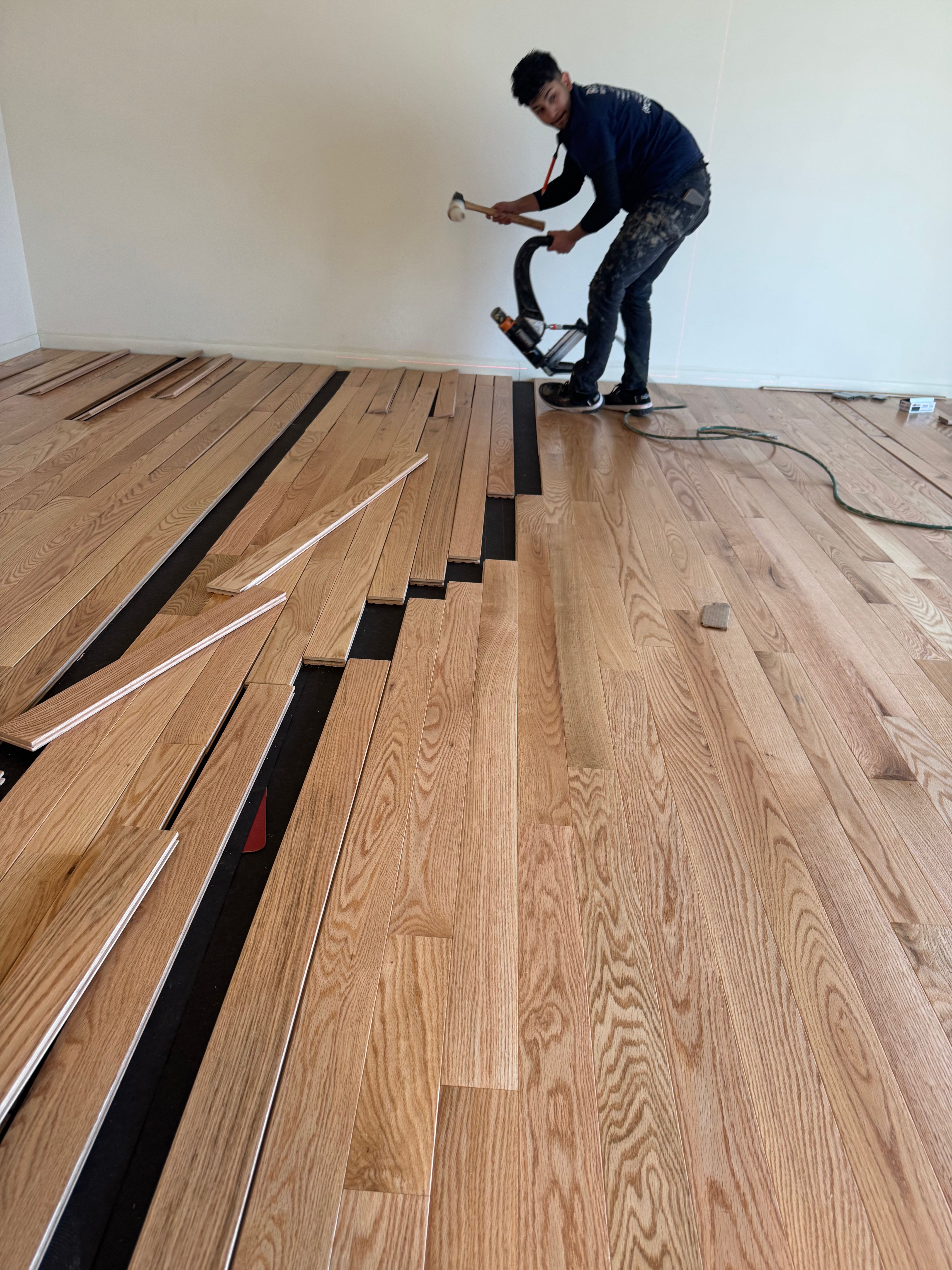 Hardwood floor installation in progress in Rockford IL home by Ramos Wood Floors
