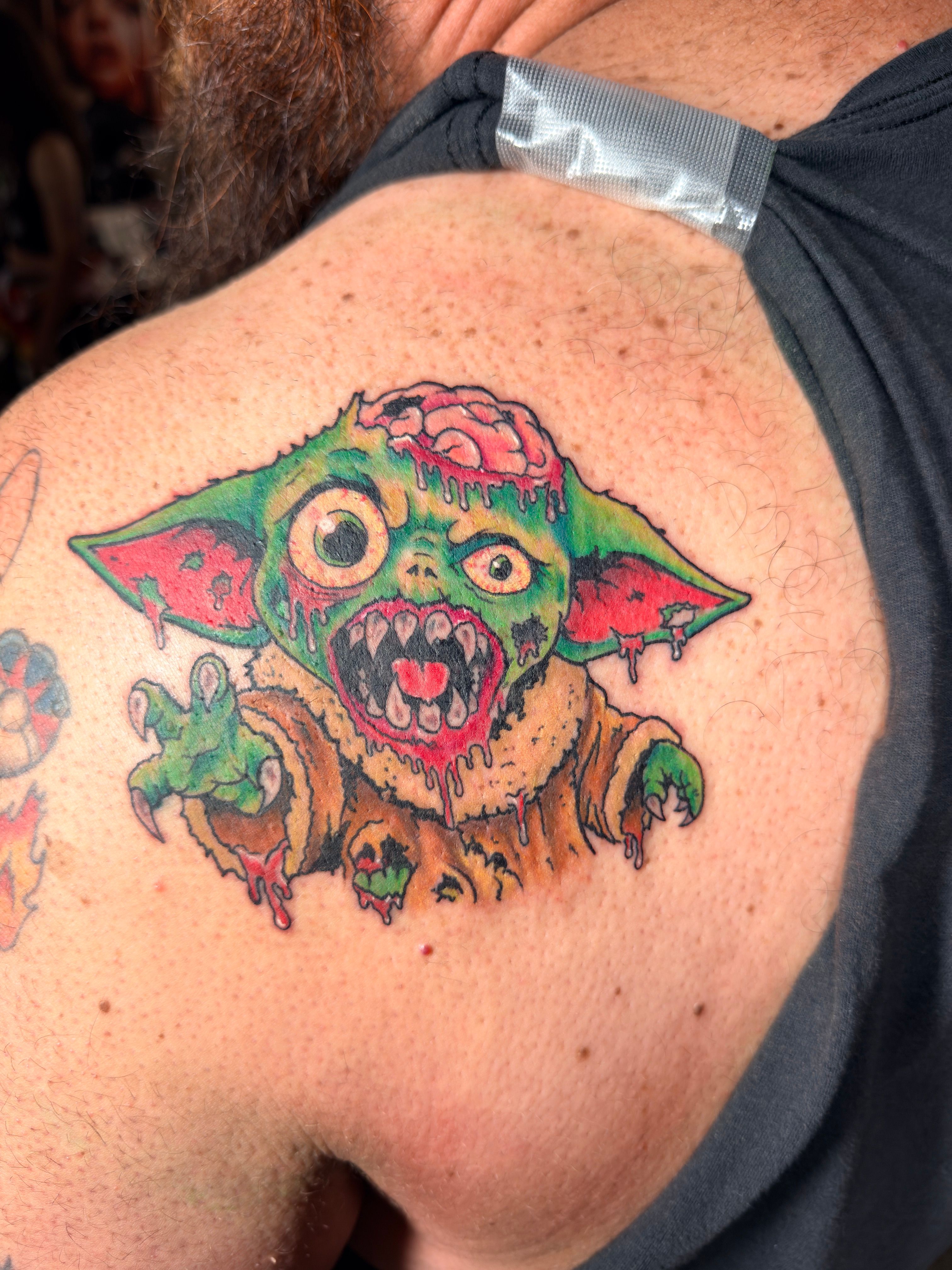 Color tattoo by Justin - green monster character with exposed brain