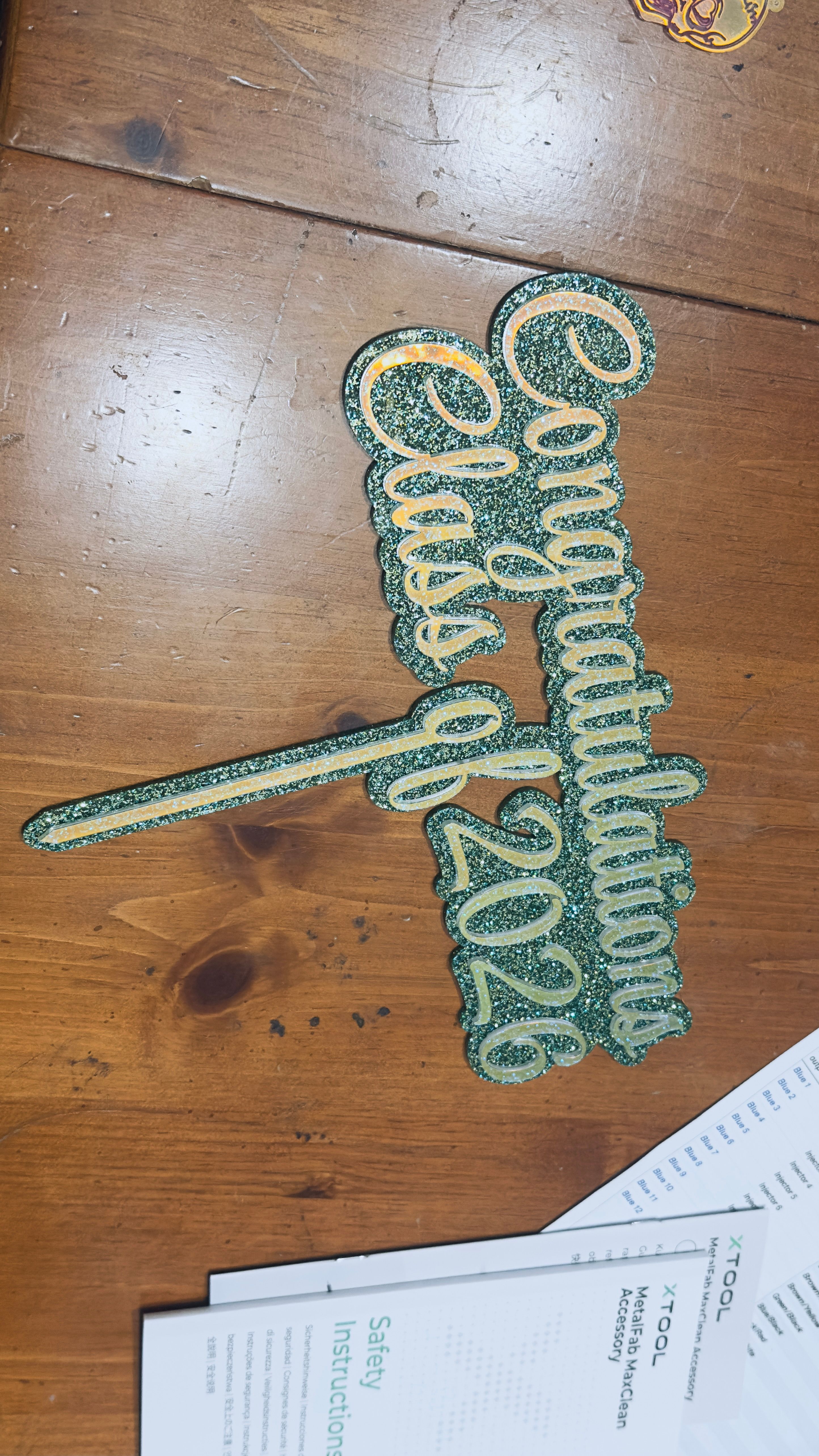 Glittery Congratulations Class of 2026 sign on a work surface