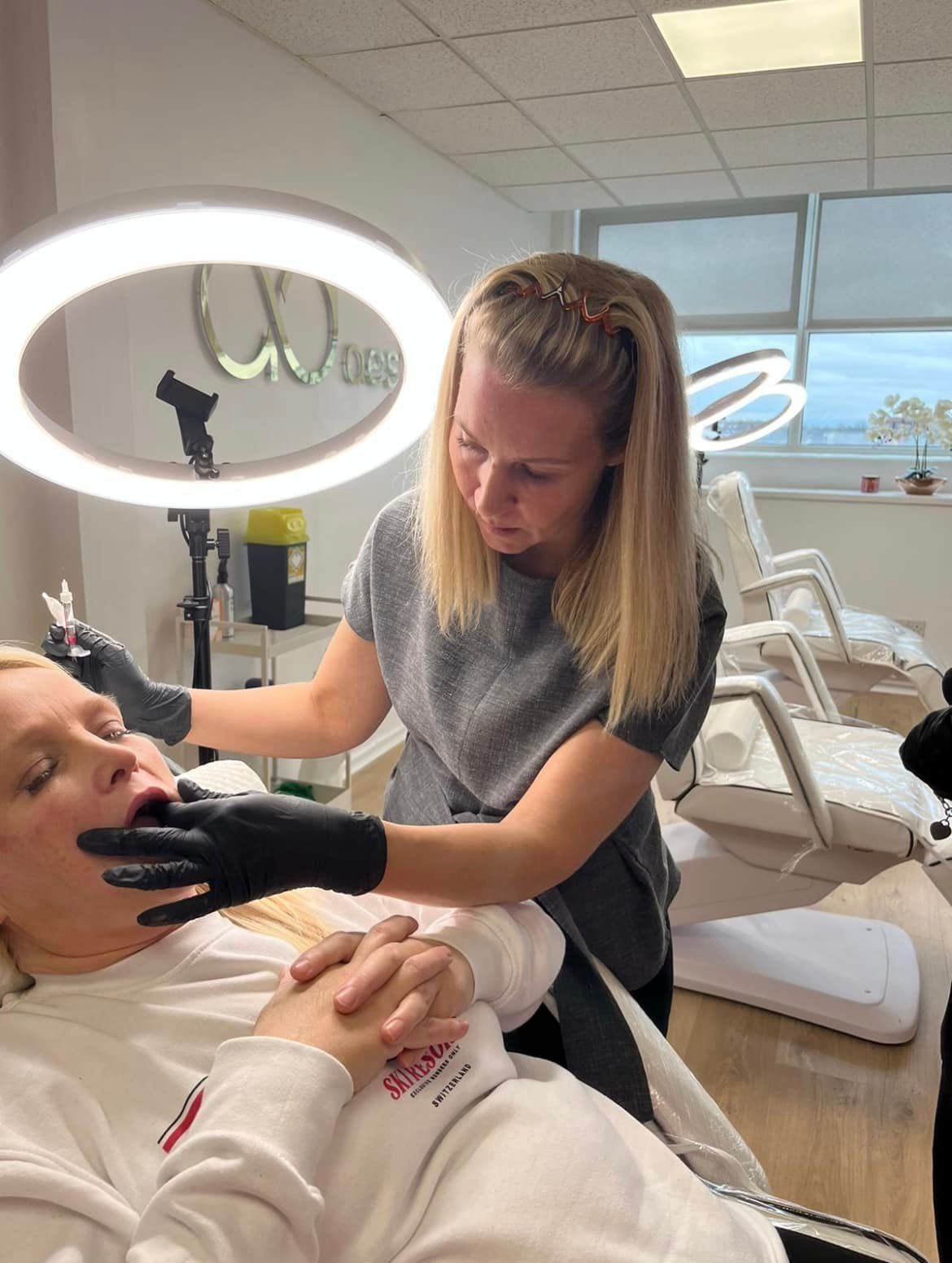 Lyndsey performing dermal filler treatment