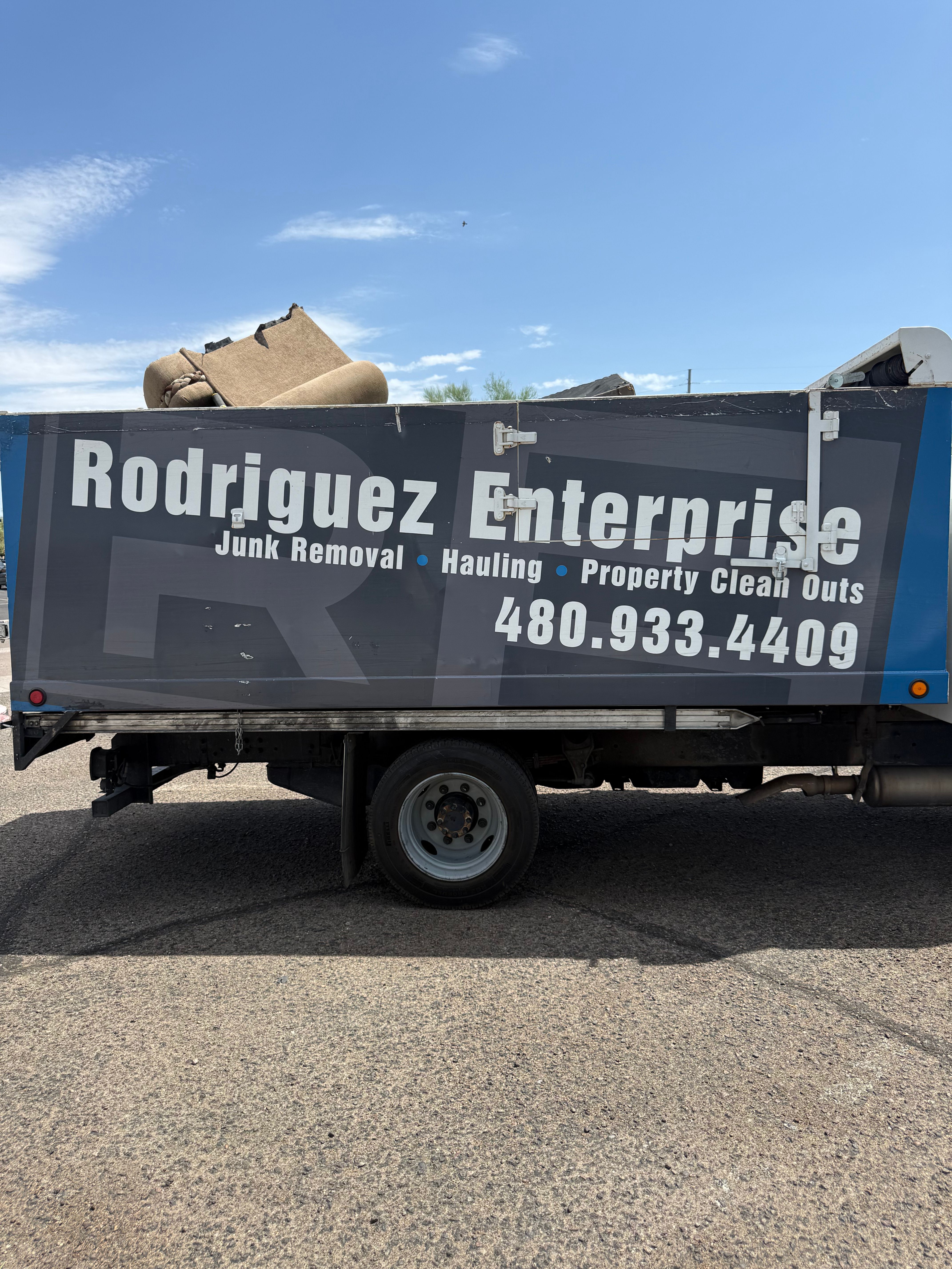 Rodriguez Enterprise branded truck on the job