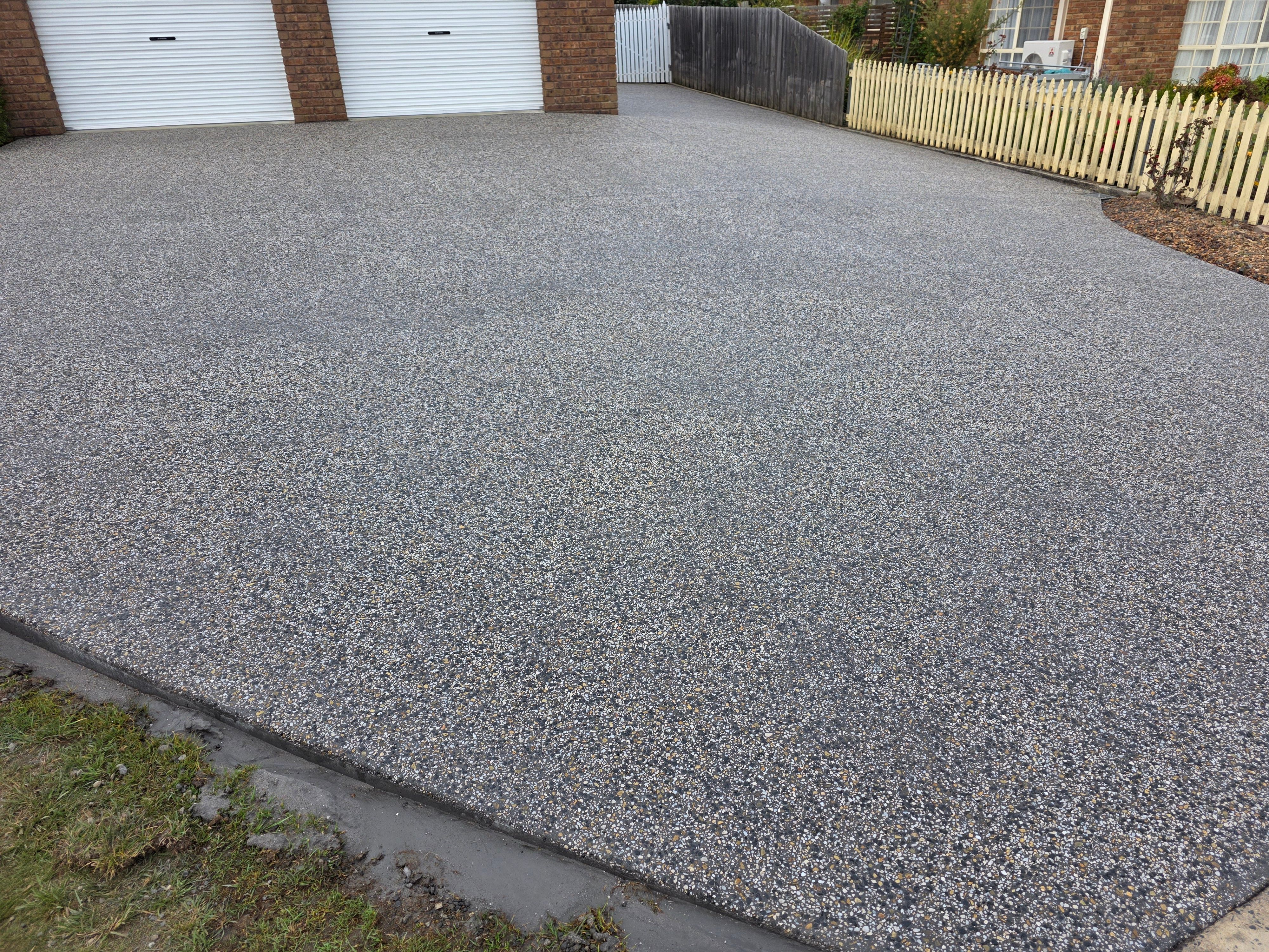 Exposed aggregate driveway with double garage