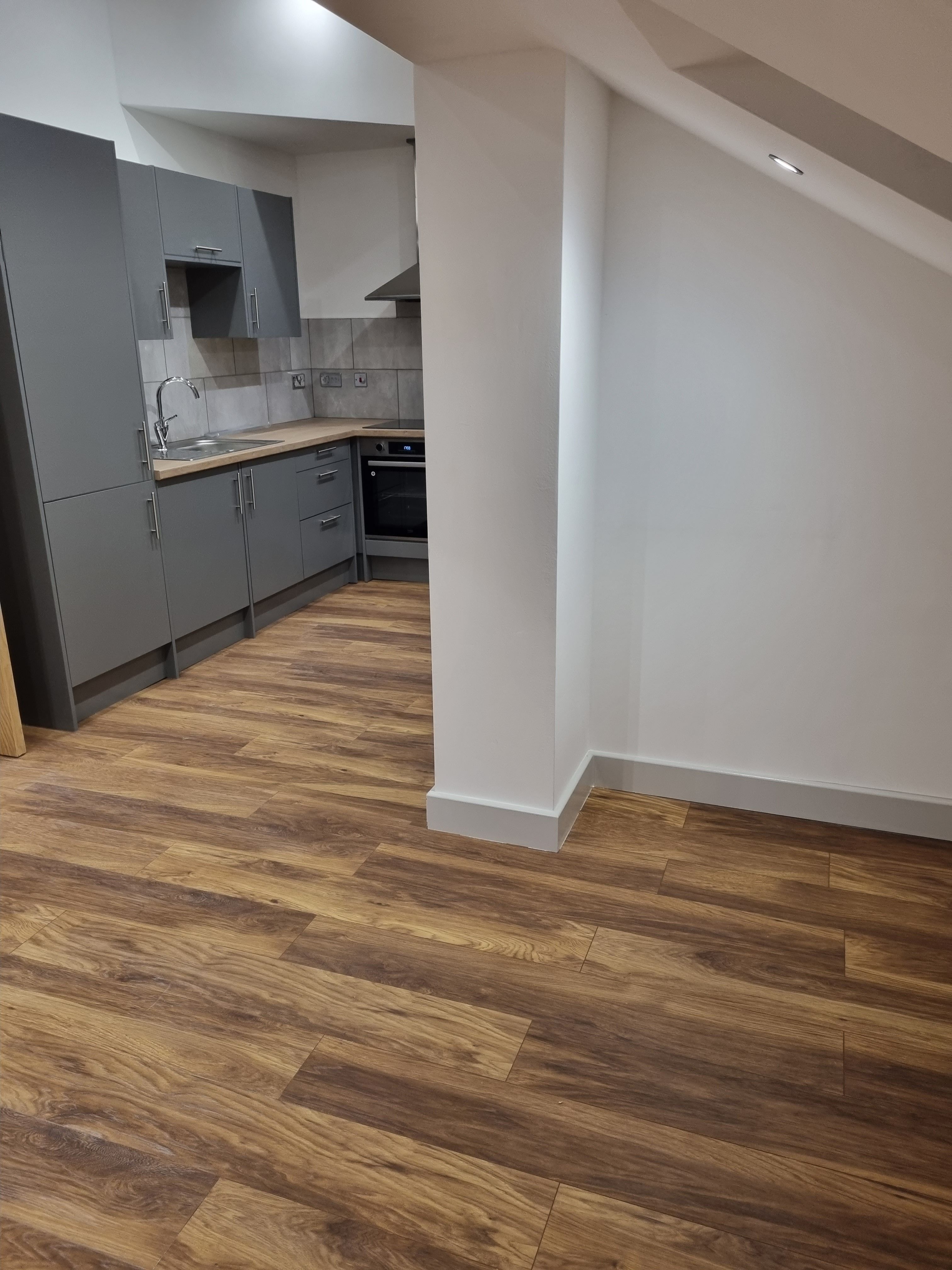 Kitchen with laminate wood flooring installation
