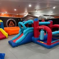 Indoor inflatable slides and play structures