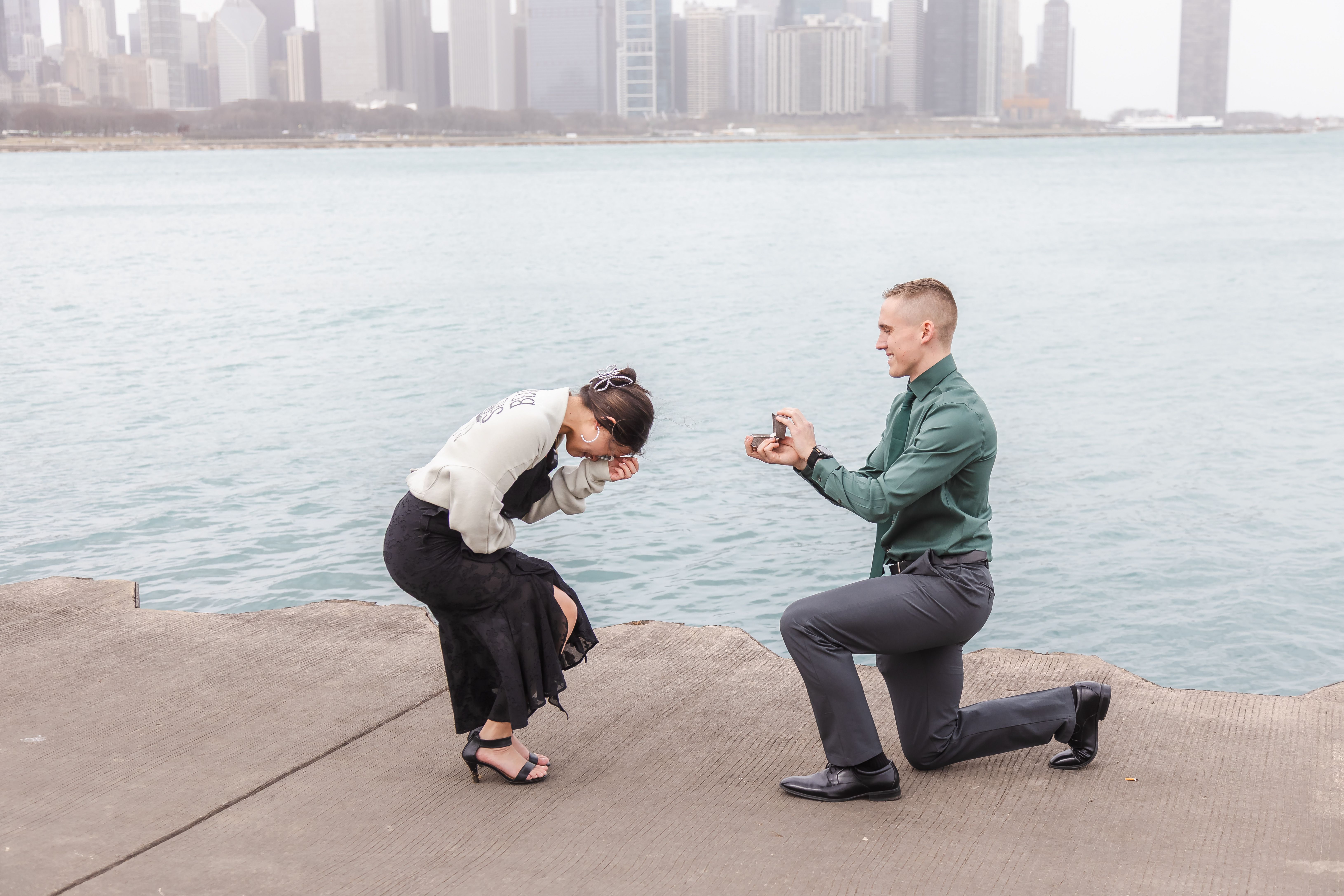 Surprise proposal moment with Chicago skyline