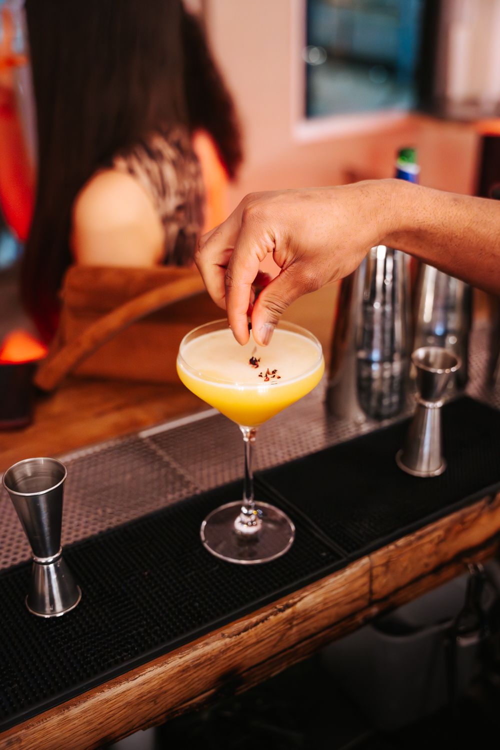Bartender crafting cocktail