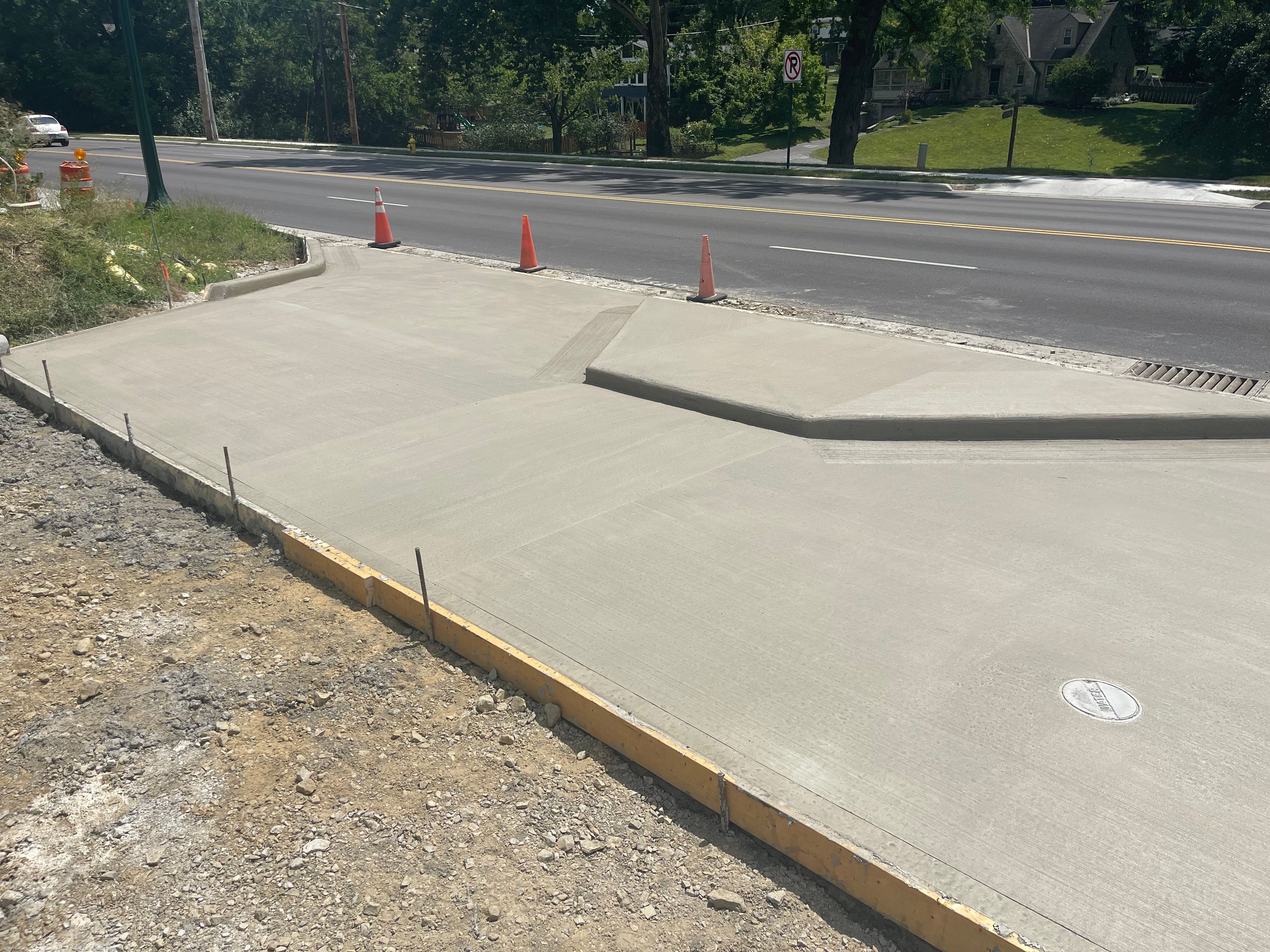 New sidewalk and ADA curb ramp pour with forms and traffic control in Columbus Ohio