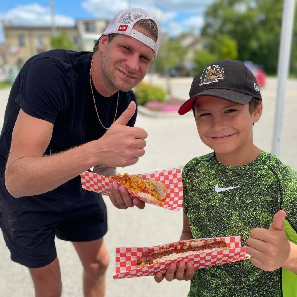 Father and son with thumbs up