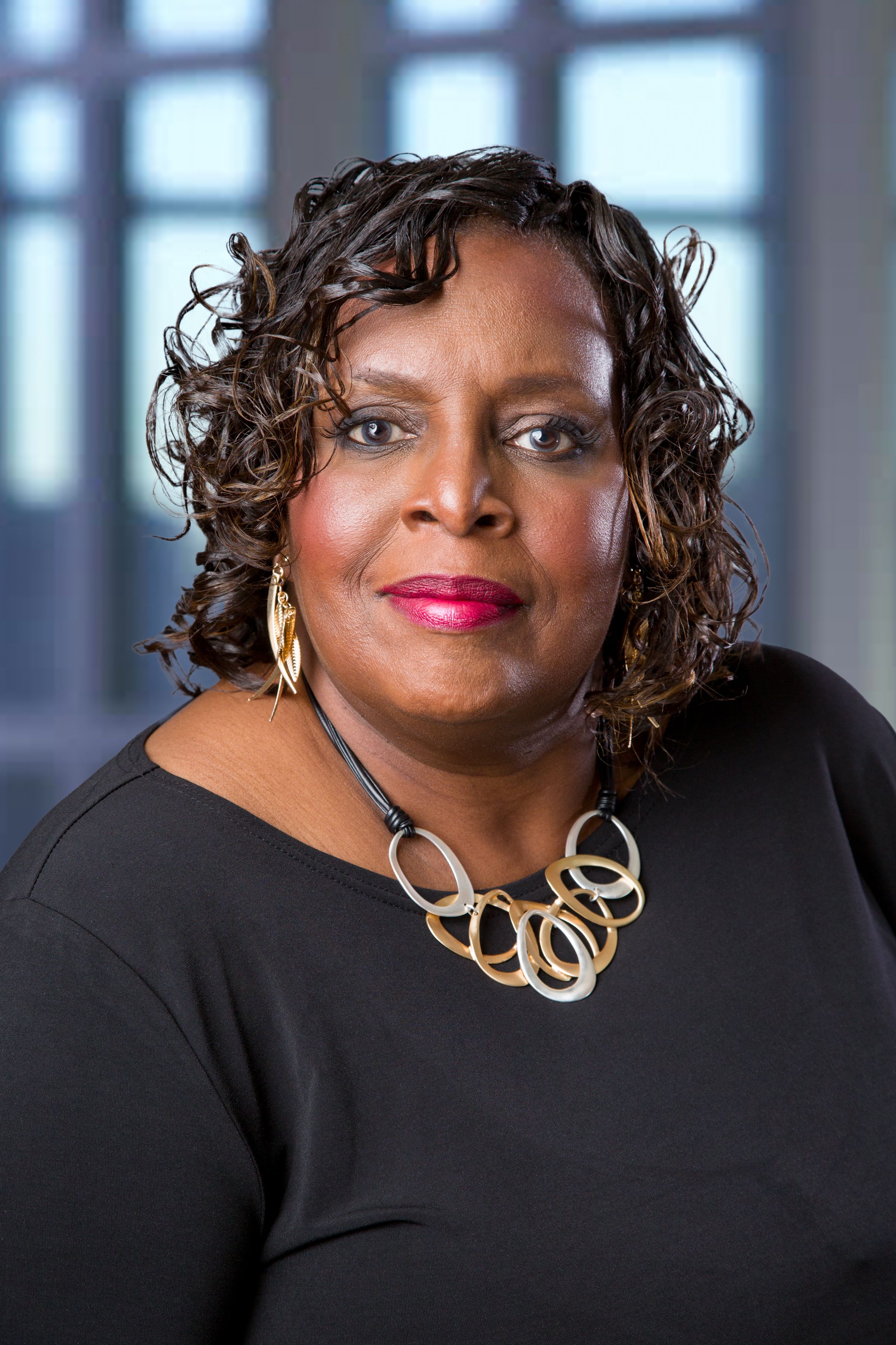 Professional headshot - woman with curly hair