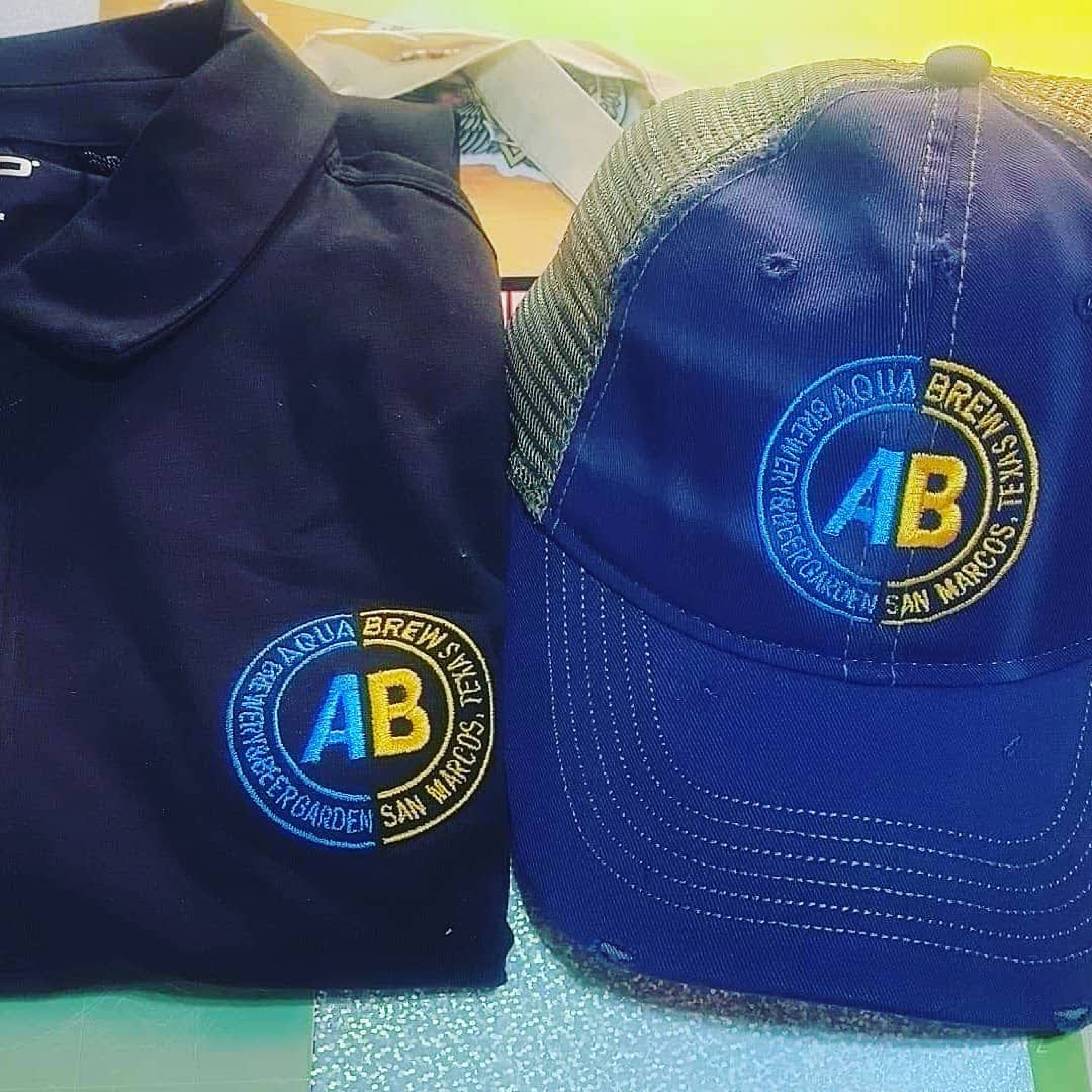 Custom embroidered Aqua Beer Garden polo shirt and hat by FUNK'S Printable Planet Austin TX