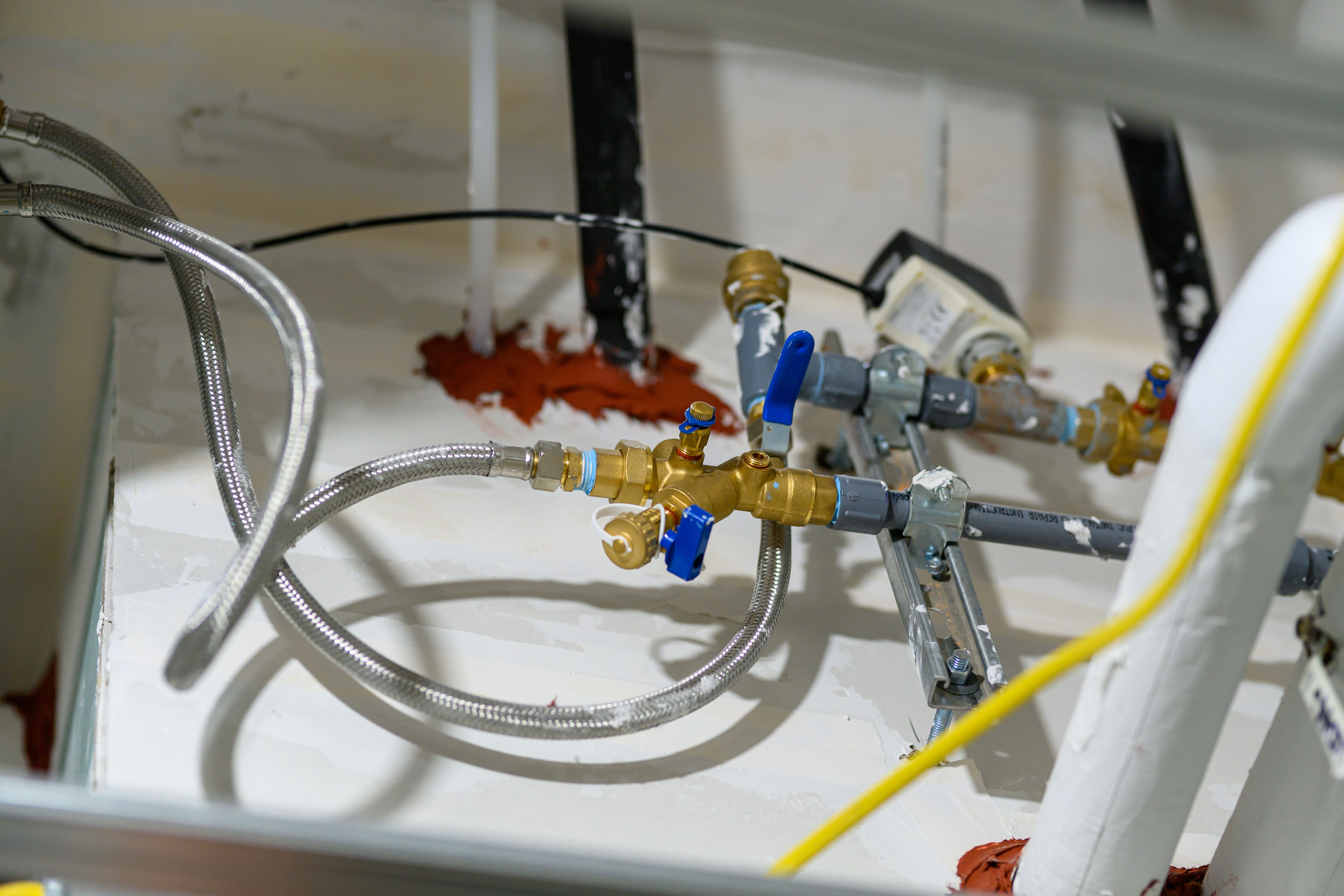 Plumber working on pipe installation