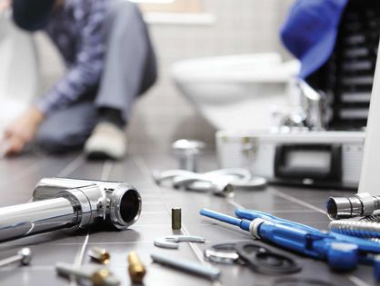 Commercial plumbing tools and toilet repair - L Ginger Plumbing commercial services