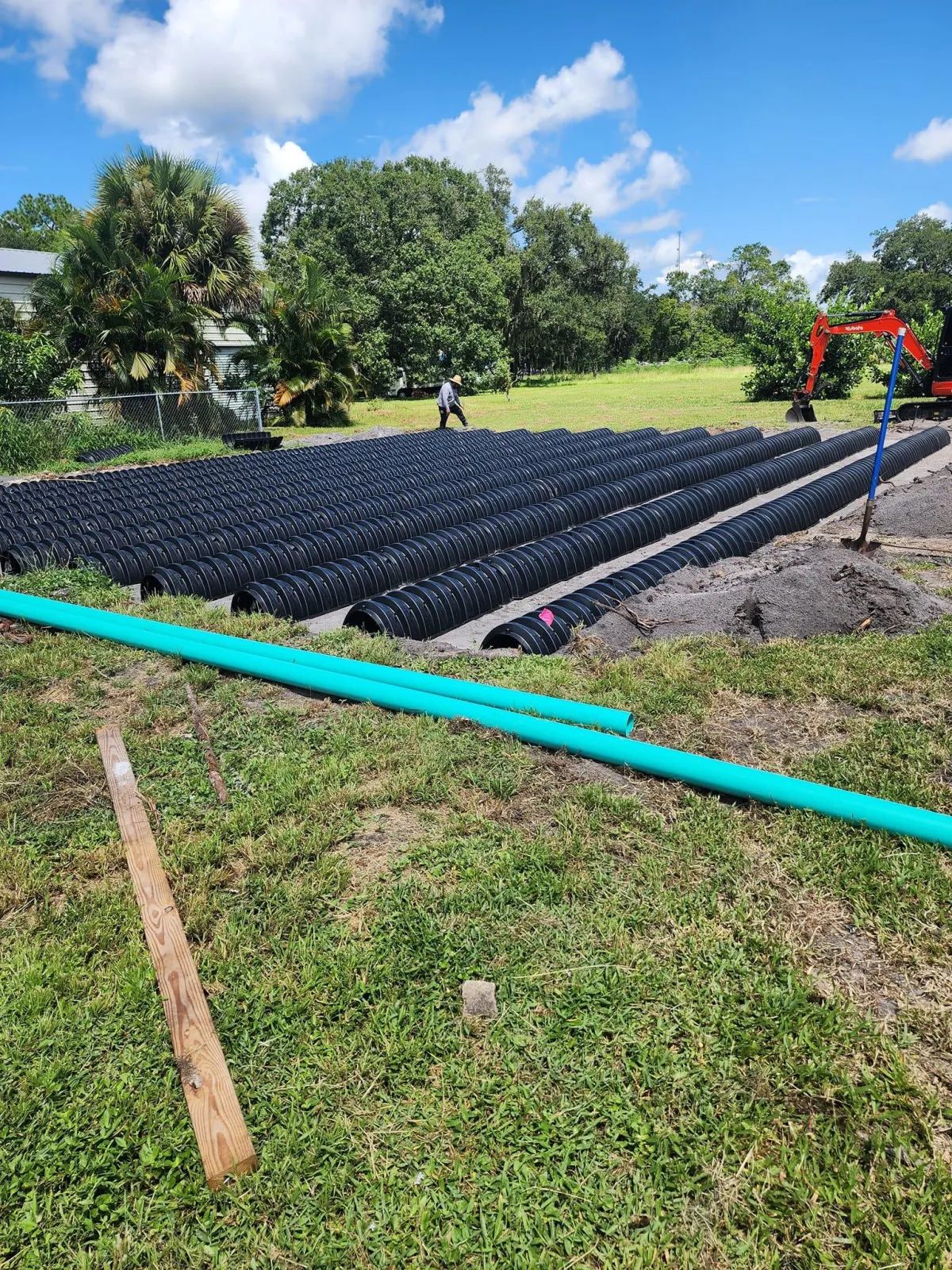 Drainfield installation with pipes being laid