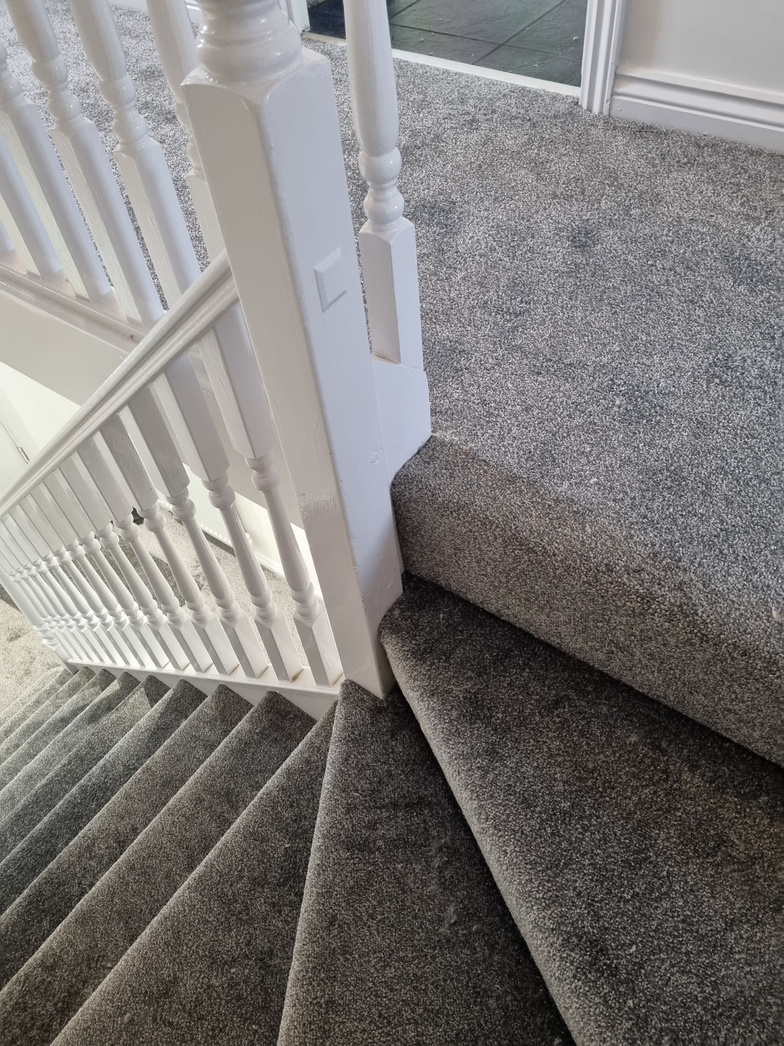 Grey stair carpet installation