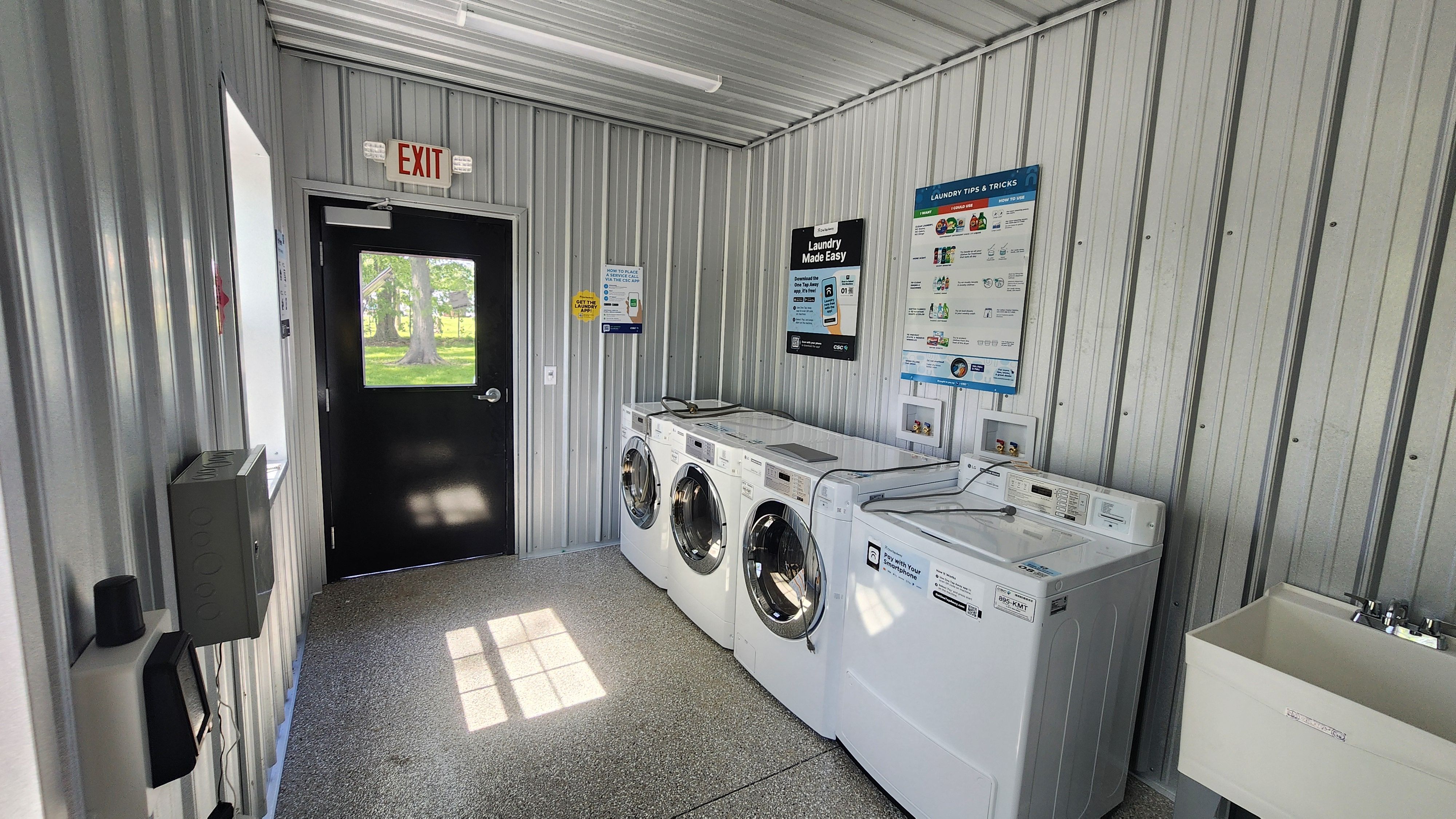 Laundry room with washers and dryers at Welcome Woods RV Campground