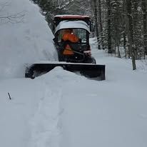Snow plowing with Kubota tractor
