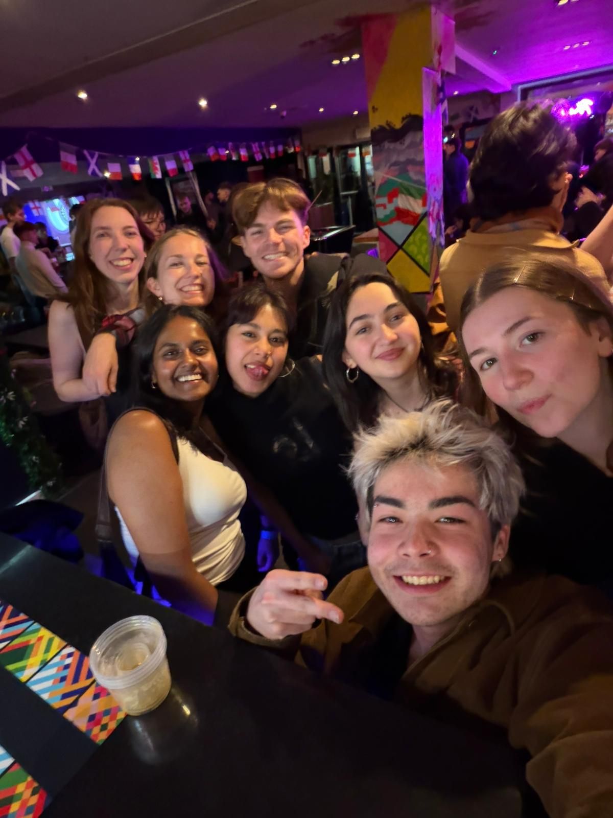 Solo travellers taking a selfie during the Ebrius Glasgow pub crawl nightlife tour