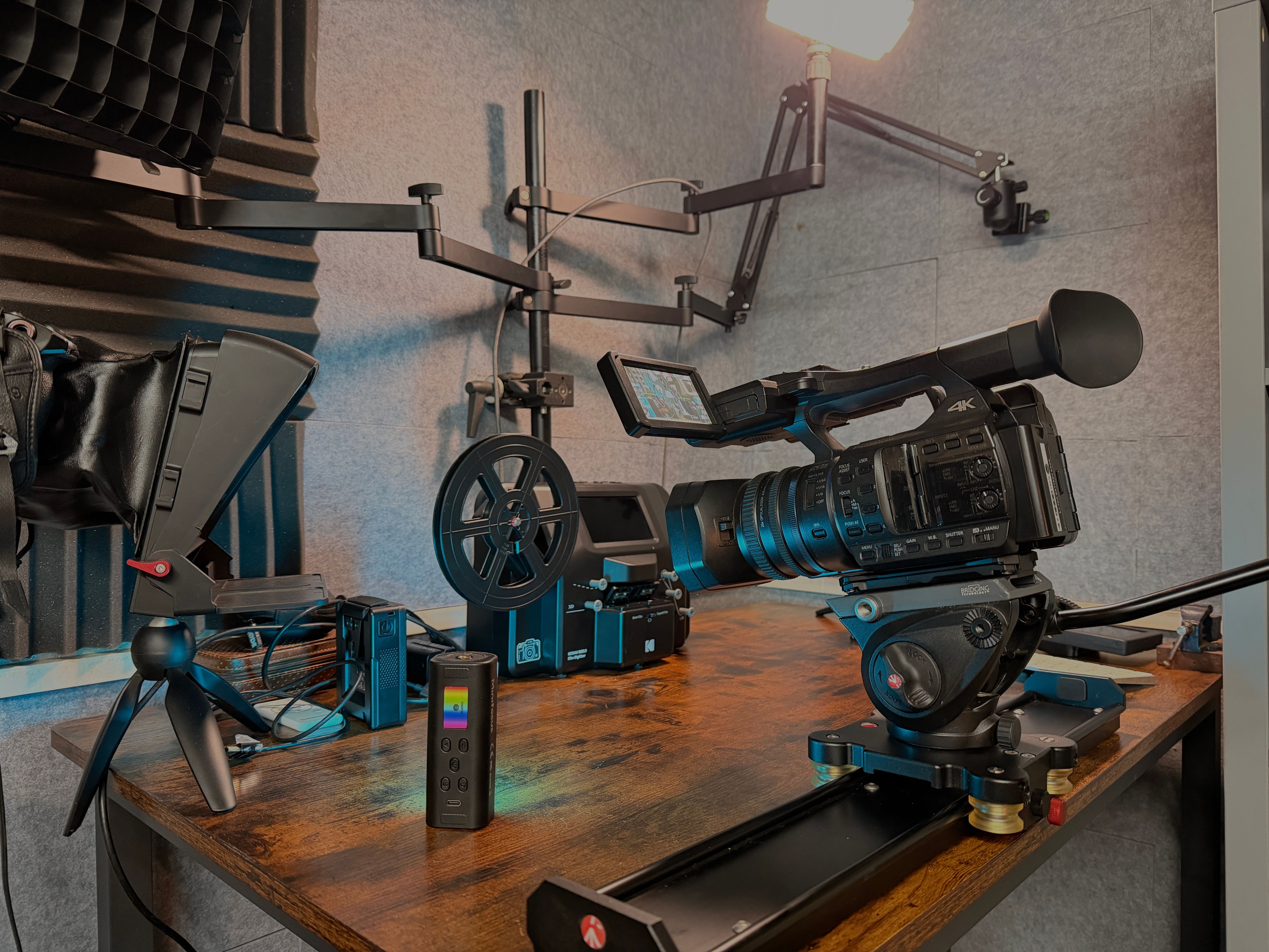 VIP studio — professional video production equipment including 4K camera, slider and vintage projector