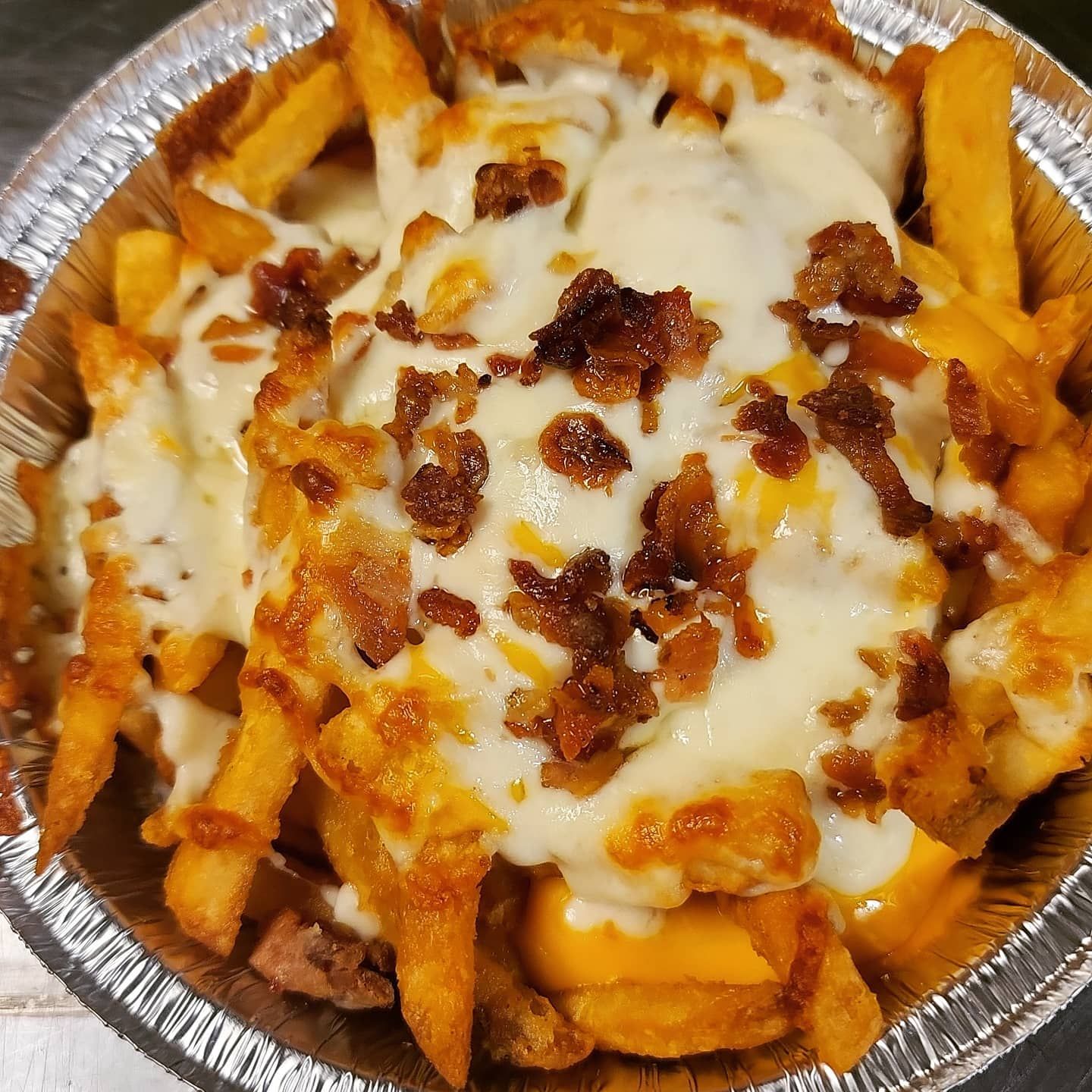 Cheese fries from JoJo's, a popular side with wings