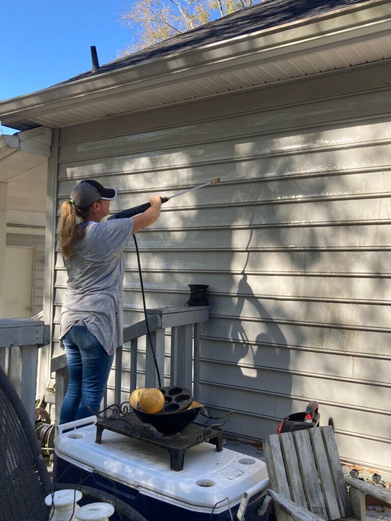 Pressure washing exterior siding