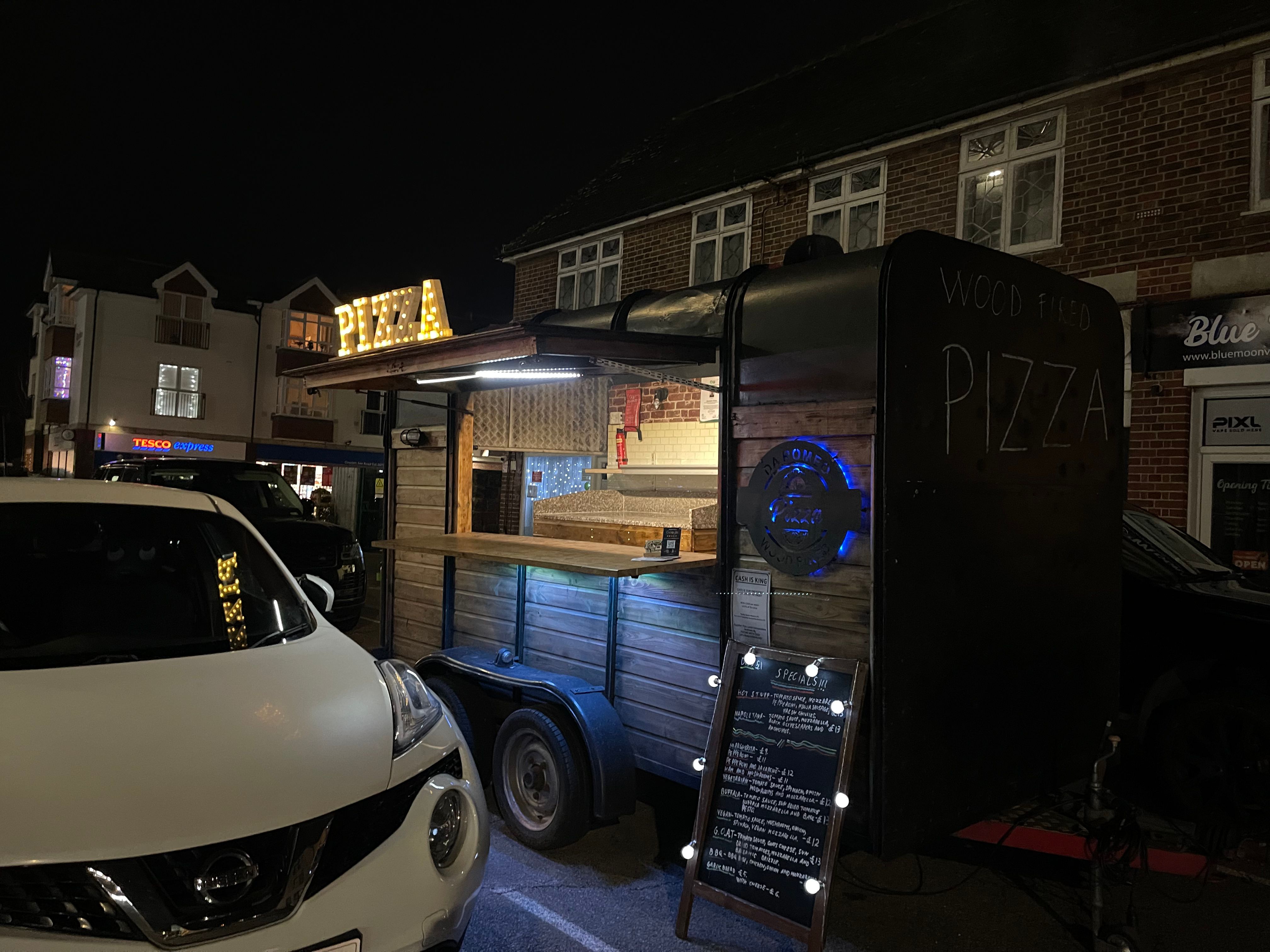 Da Romeo horse box lit up at night with PIZZA sign
