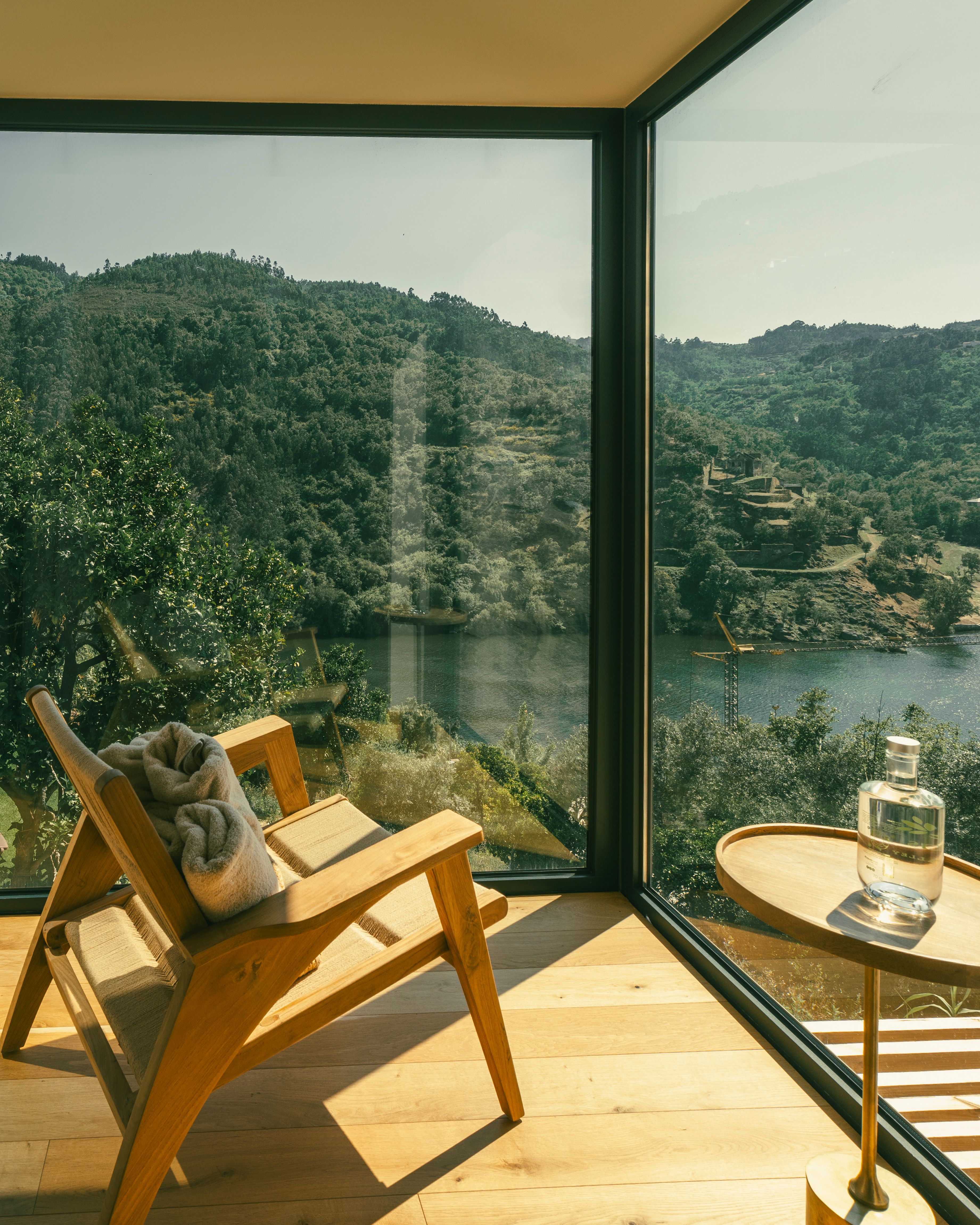 Atmospheric boutique hotel interior with natural light overlooking green hills in northern Portugal — hospitality photography by Pedro Tavares, Porto