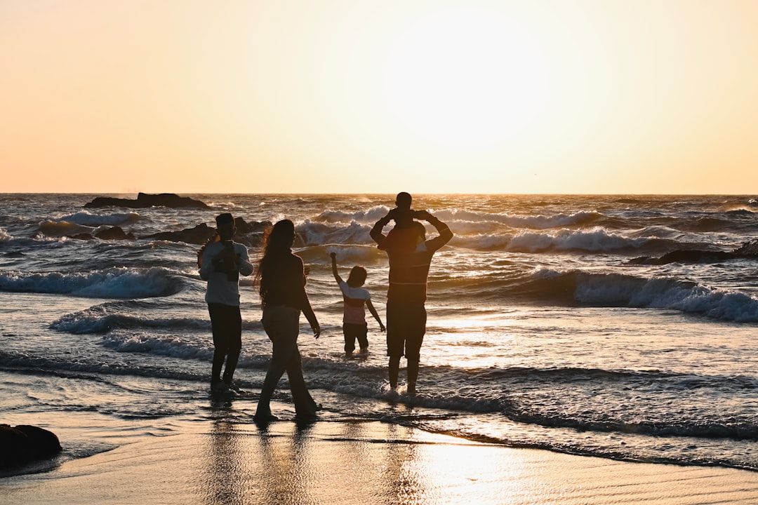 Family enjoying sunset at the beach