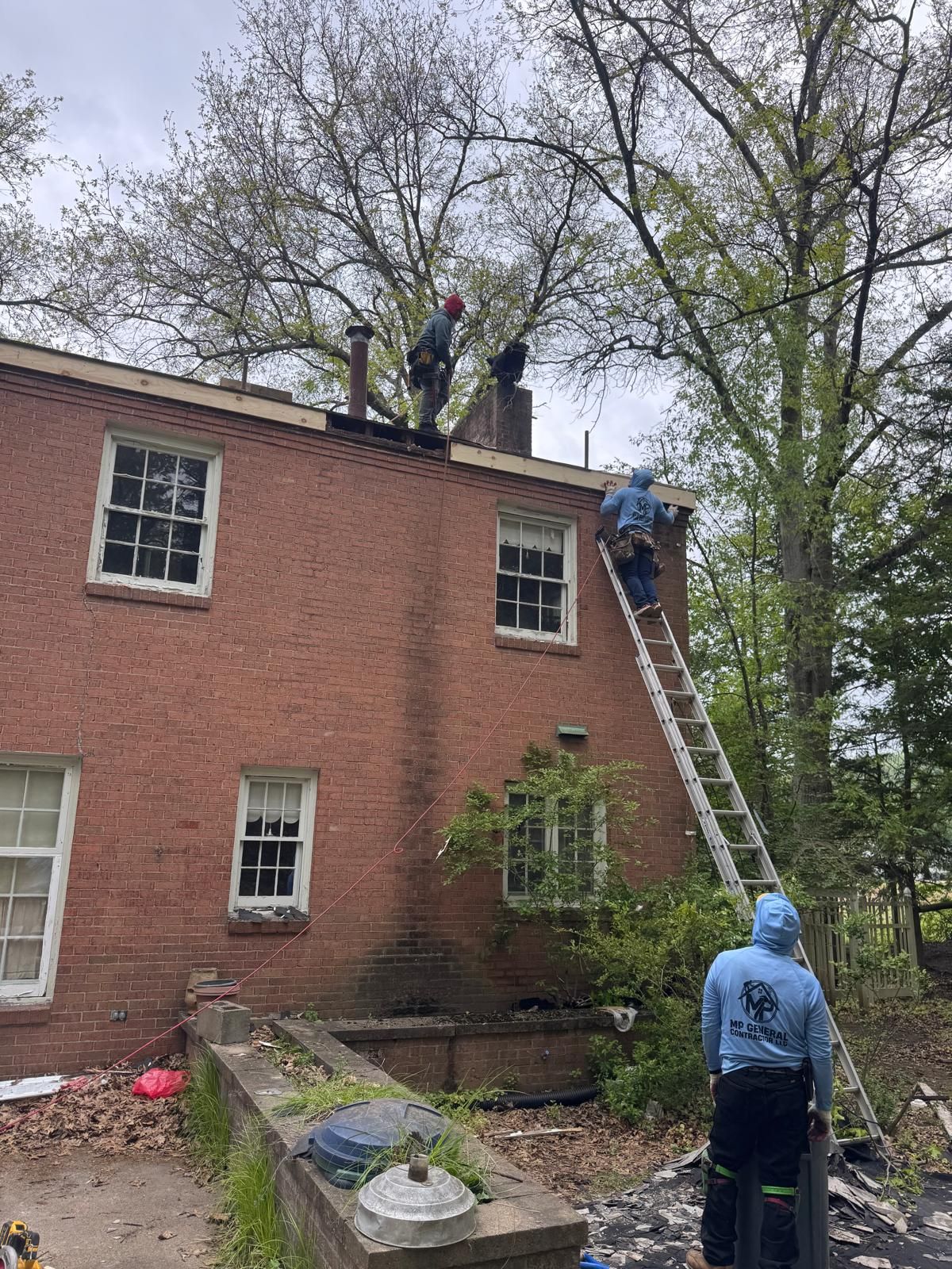 MP General Contractor crew working on a roof