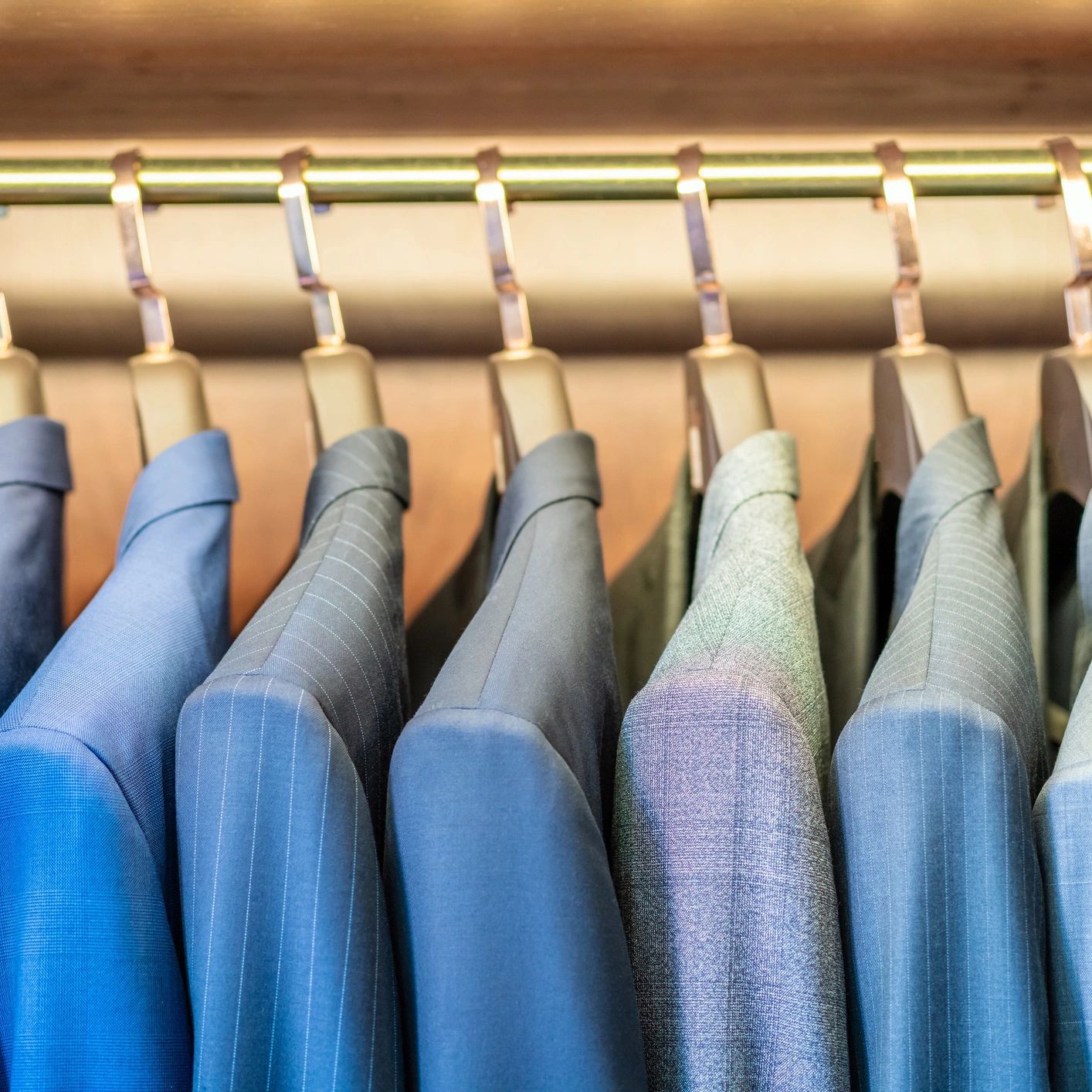 Custom suit collection on display — BLU Fine Menswear Houston