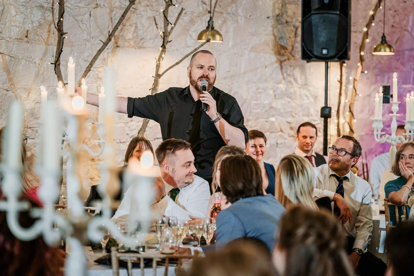 Ryan Wallace — The Opera Guy performing live at an intimate candlelit event with captivated audience