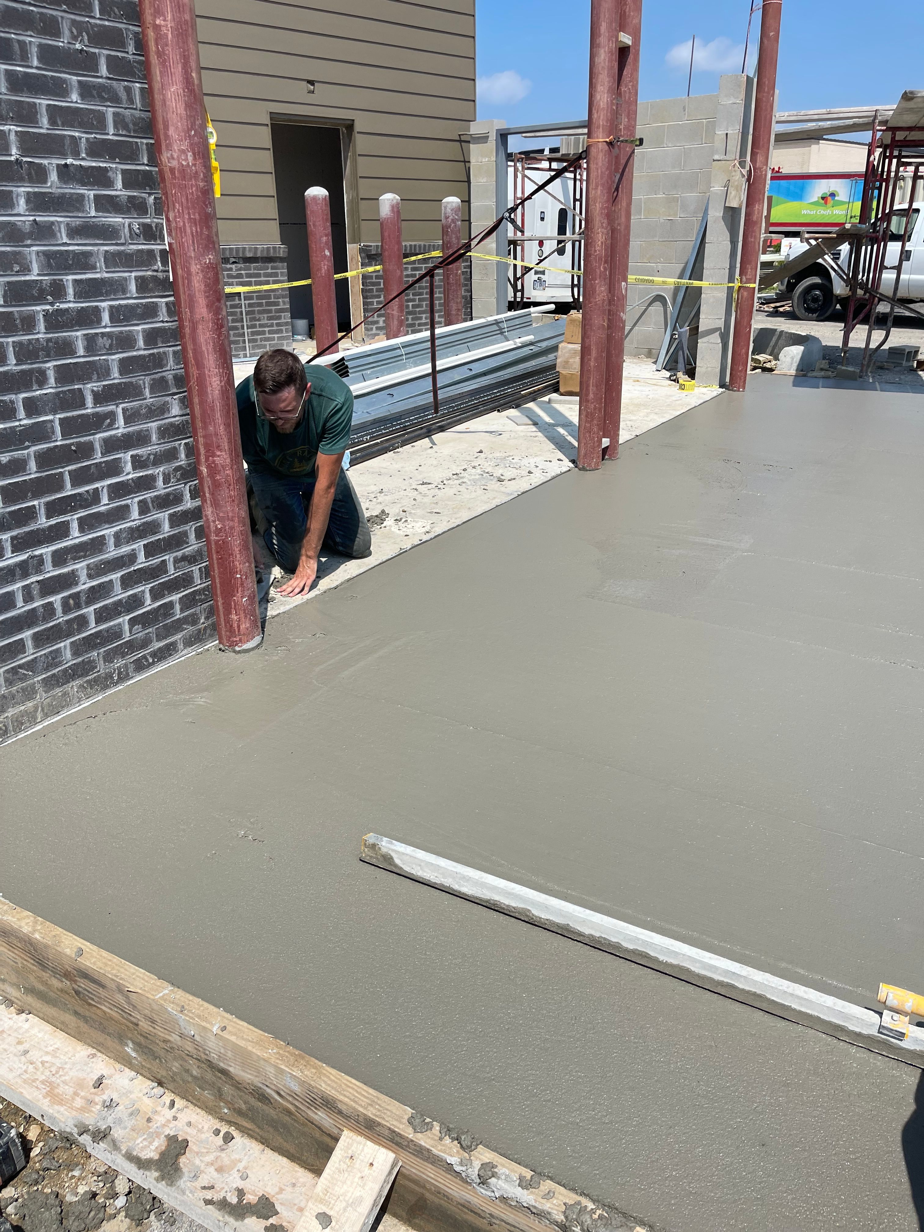 Concrete slab finish with PVC rough-ins for a commercial project in Central Ohio