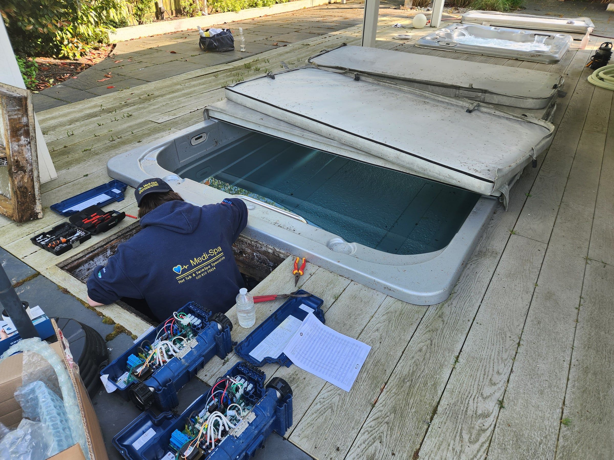 Medi-Spa technician working on hot tub electrics and wiring