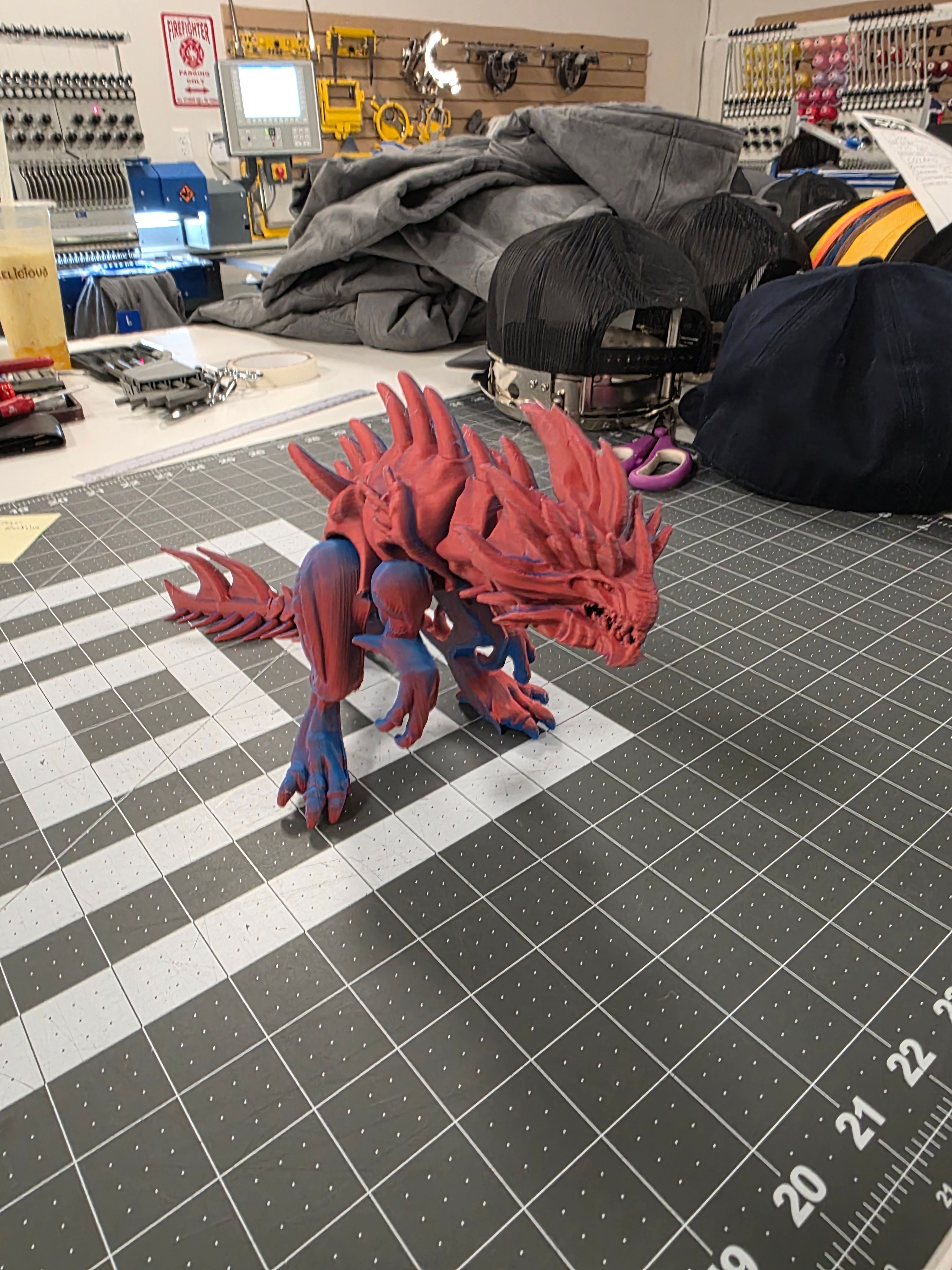 Red and blue articulated dragon figure