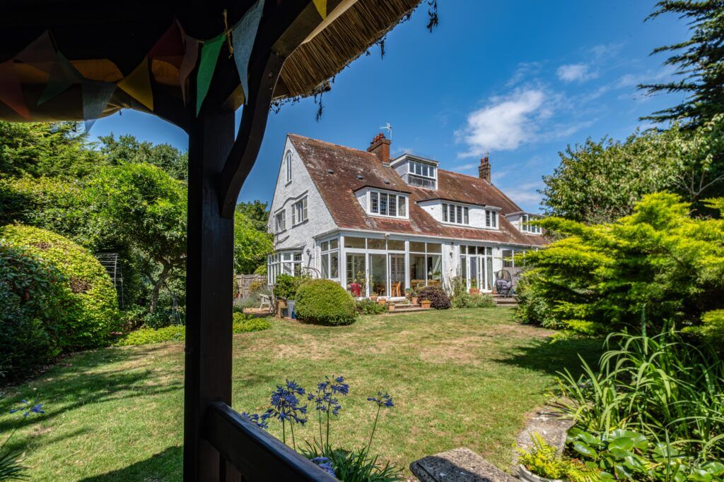 White house exterior with garden — professional property photography