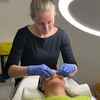 Lyndsey performing a skin treatment